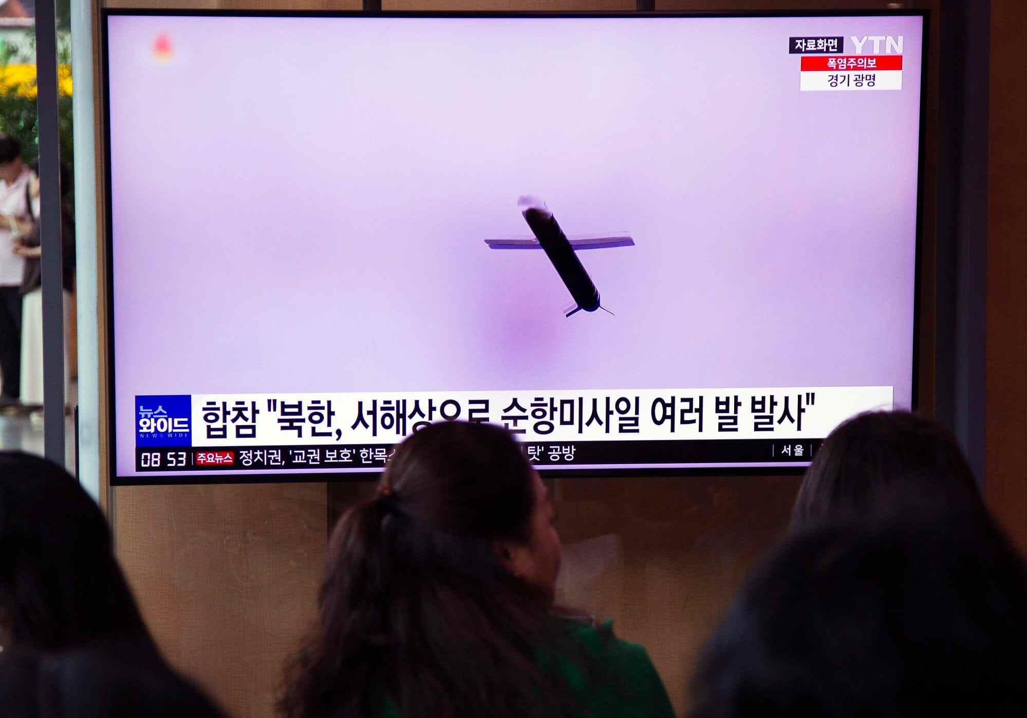 People watch a news report on a North Korean cruise missile launch in Seoul, South Korea on July 22, 2023. Photo: EPA-EFE