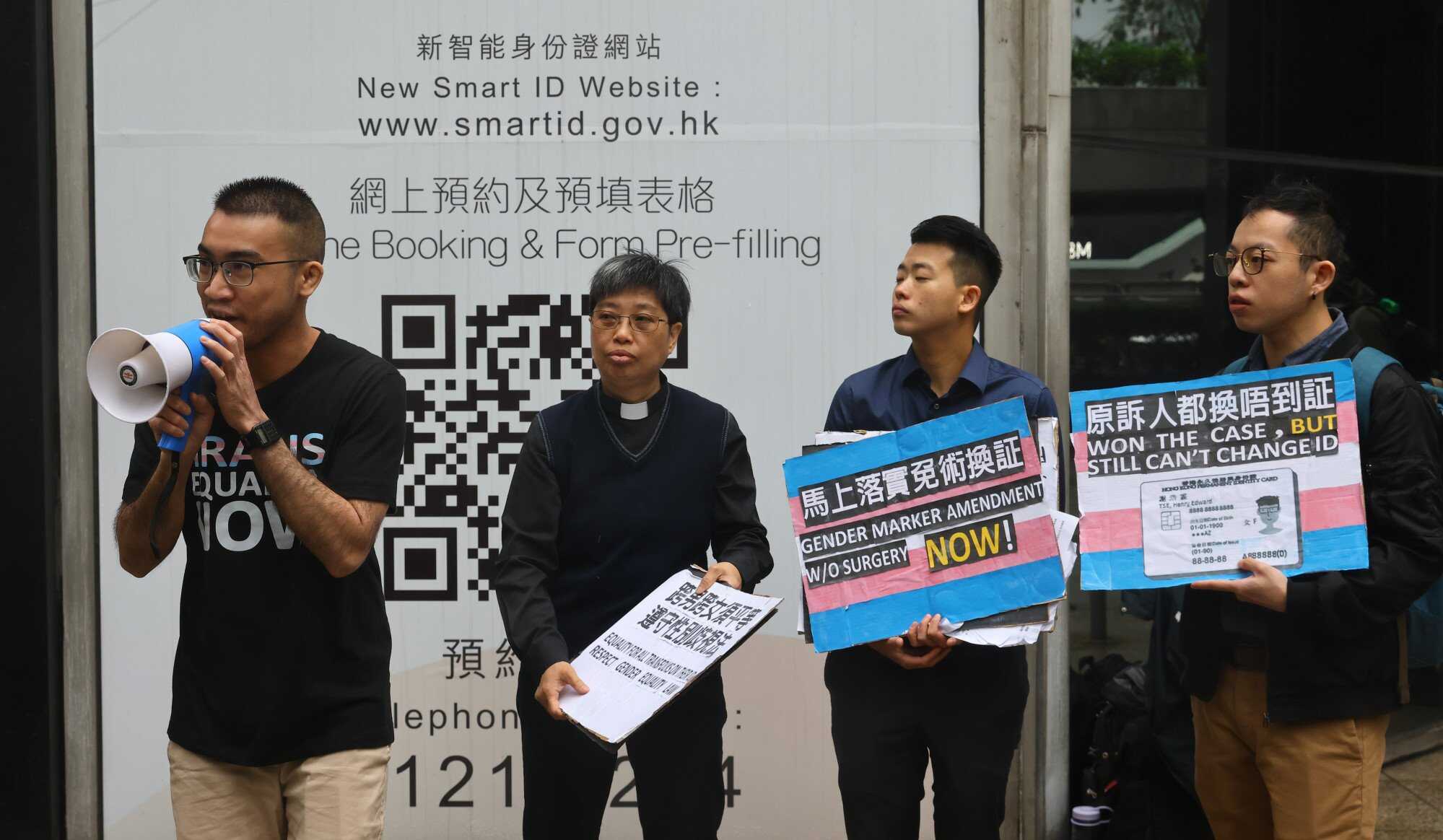 Henry Edward Tse (left) and other activists protested outside the Immigration Department to call for faster handling of their identity card applications. Photo: Dickson Lee