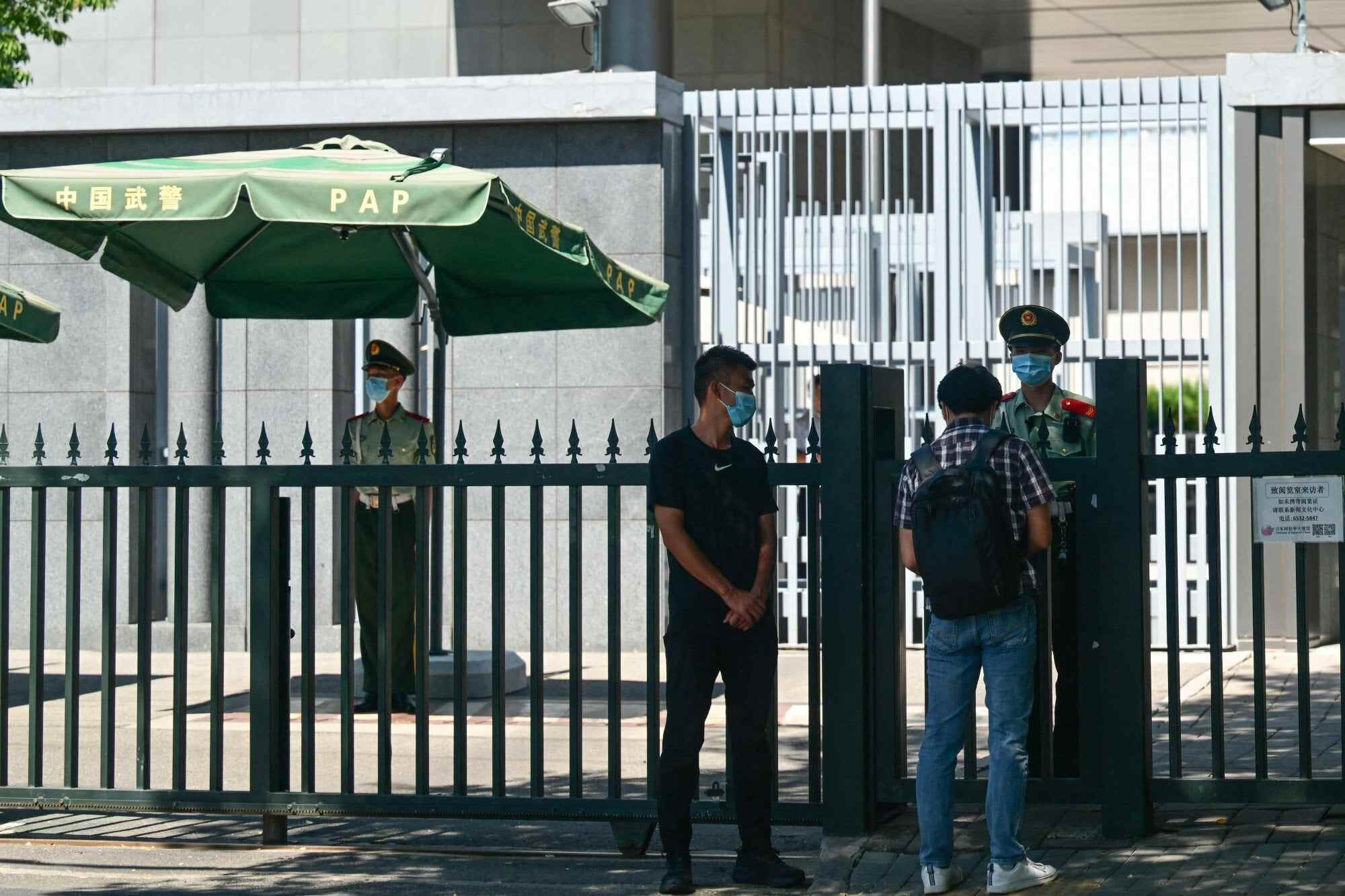 Police and security personnel stand outside the entrance of the Japanese embassy in Beijing on August 29, 2023. Photo: AFP