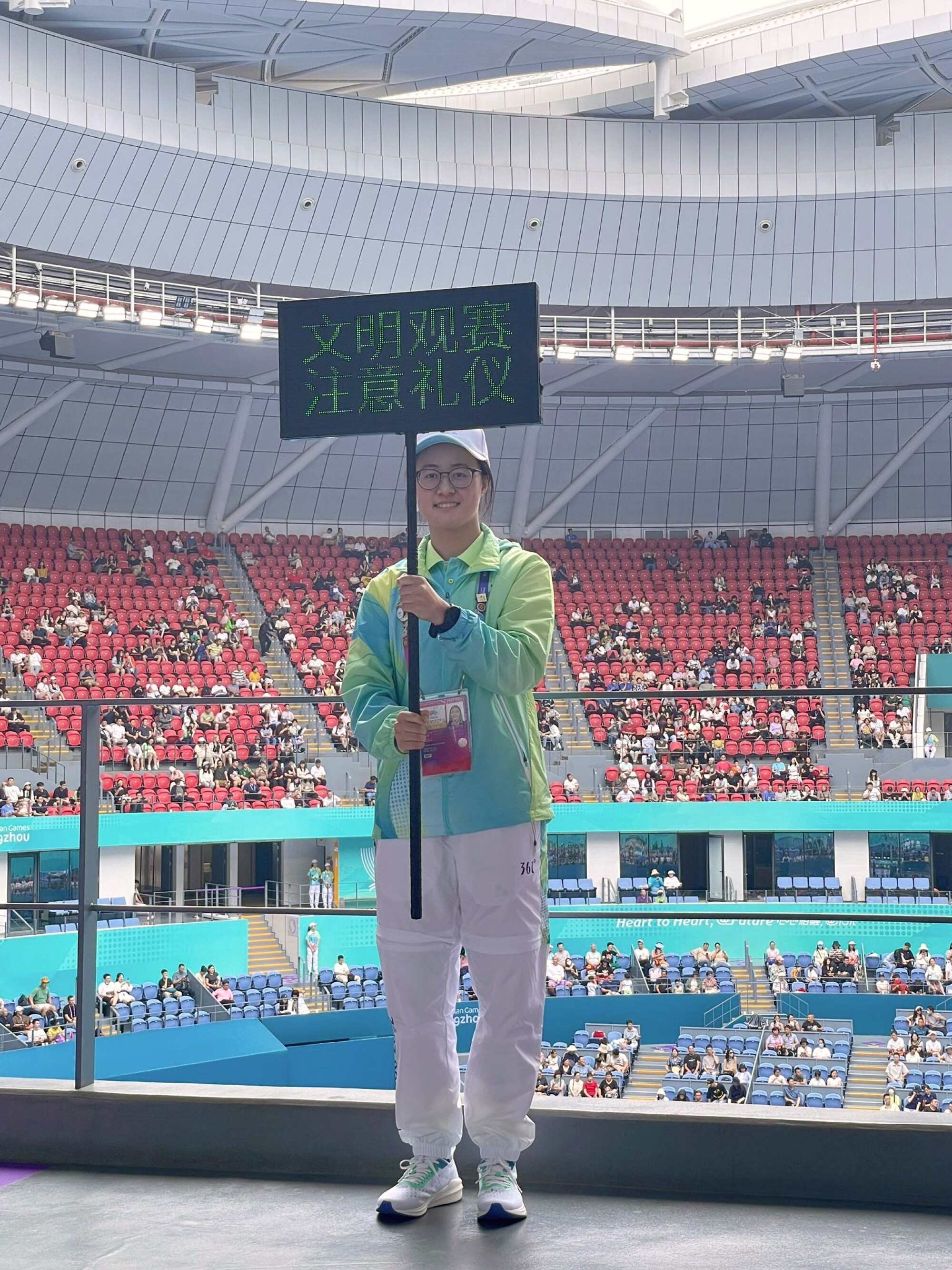 Some volunteers’ duties were to maintain order at the tennis stadium. Photo: Handout