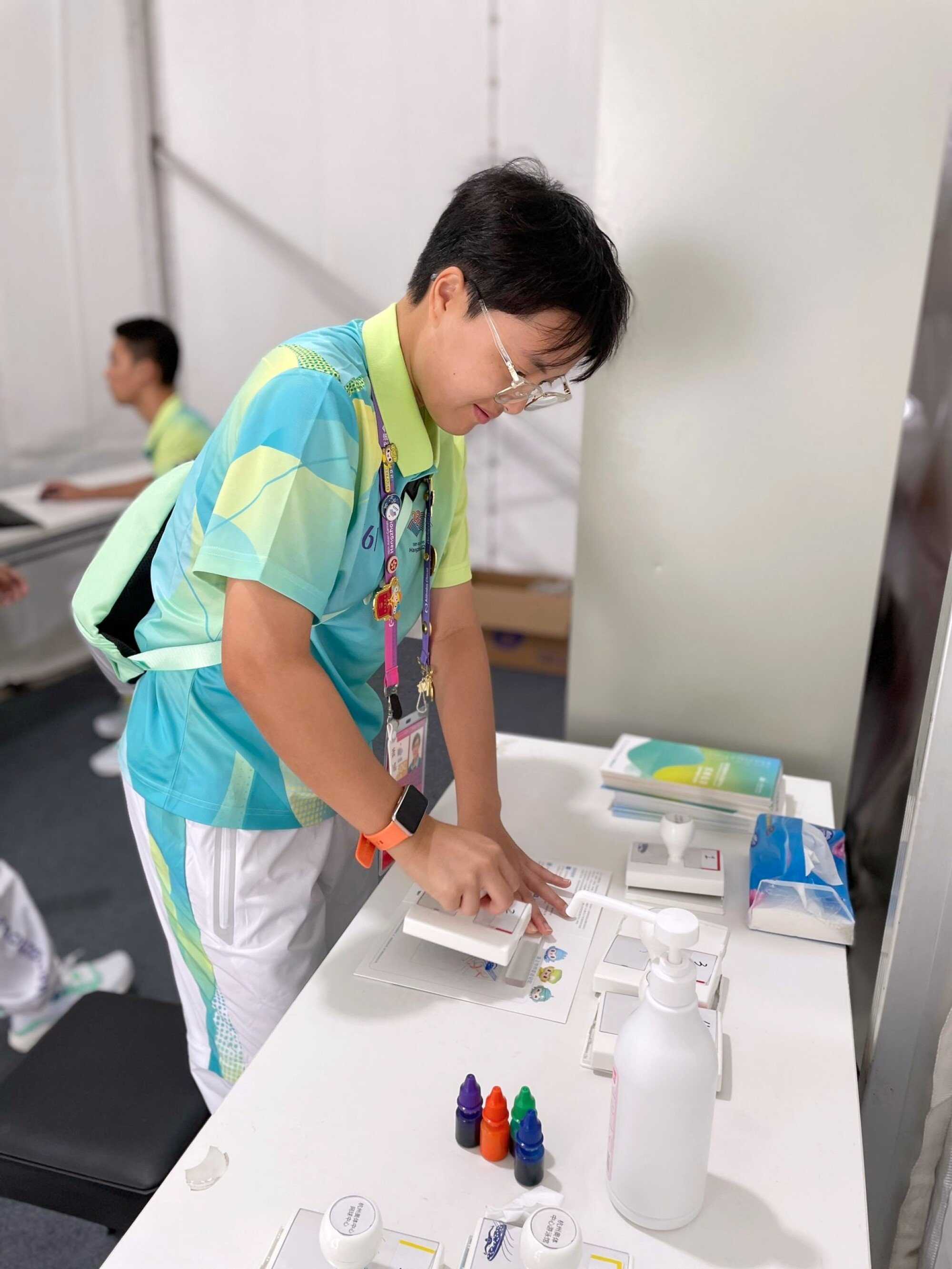 Siu Ying was assigned to stamp tickets for spectators. Photo: Handout