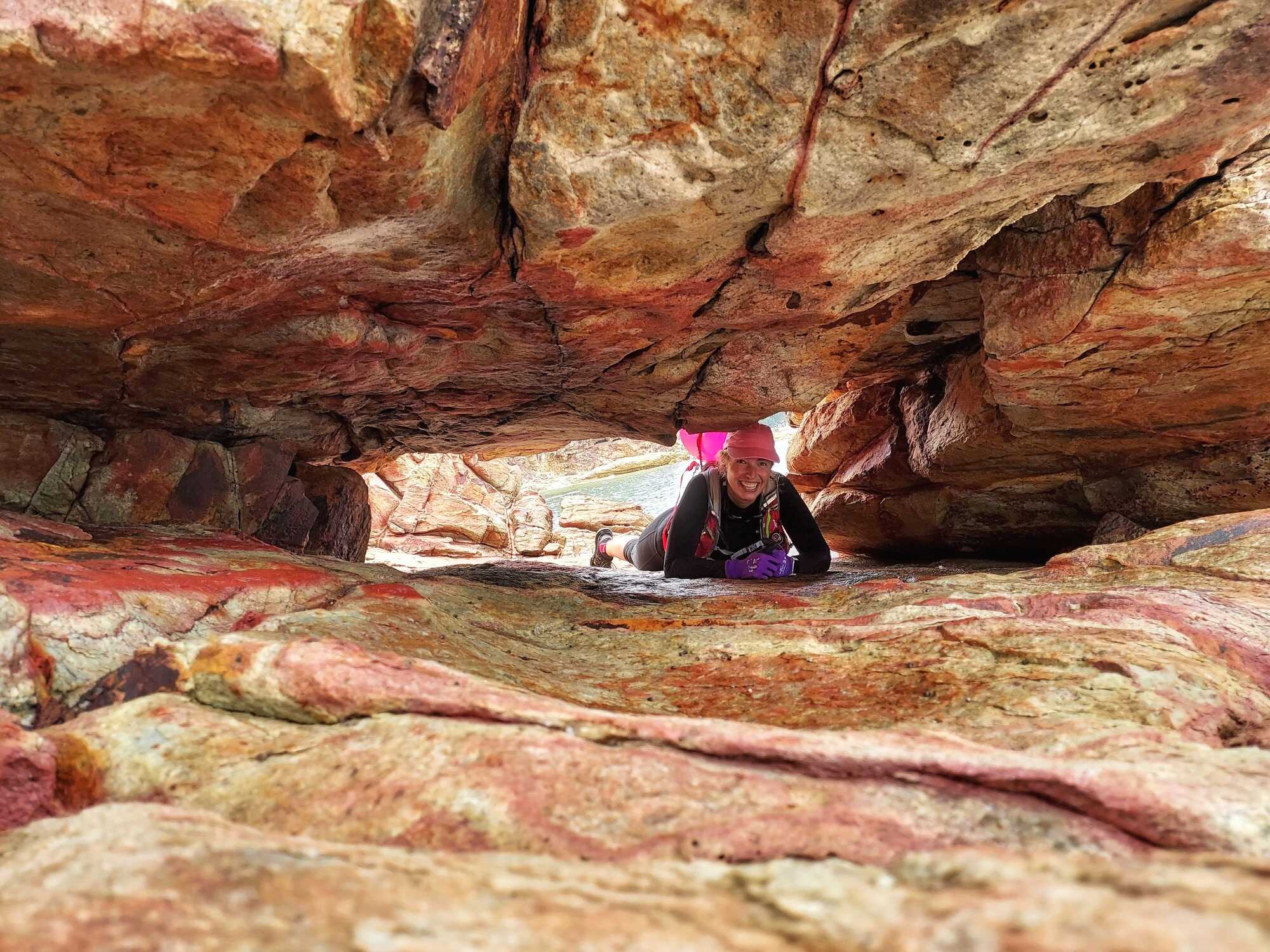 Cathy Cole between some rocks in Shui Hau, Lantau Island. Photo: Charmian Woodhouse