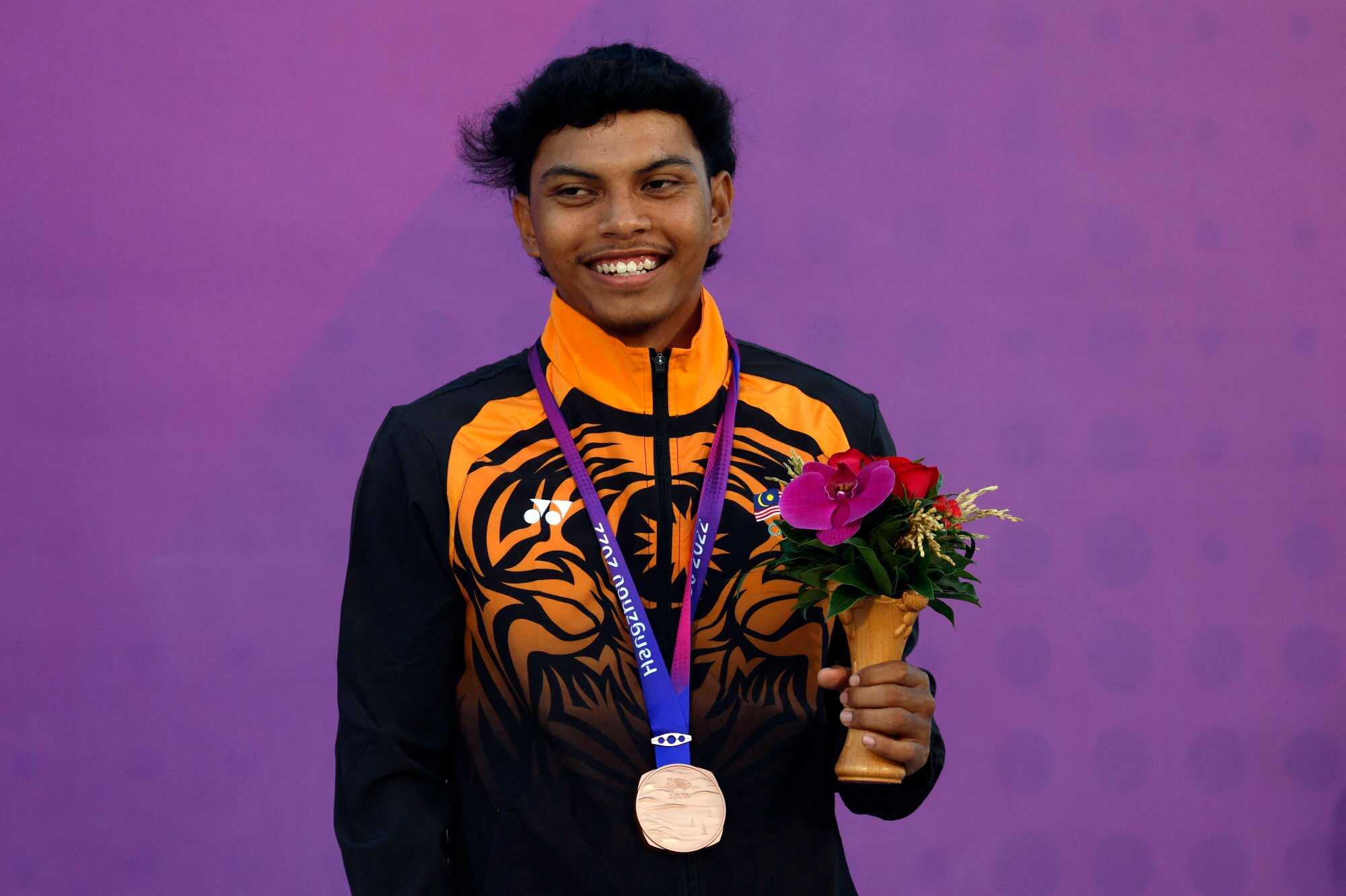 Malaysia’s Muhammad Asnawi Iqbal Bin Adam was a bronze medallist for the boys’ Dinghy ILCA 4 category. Photo: Reuters