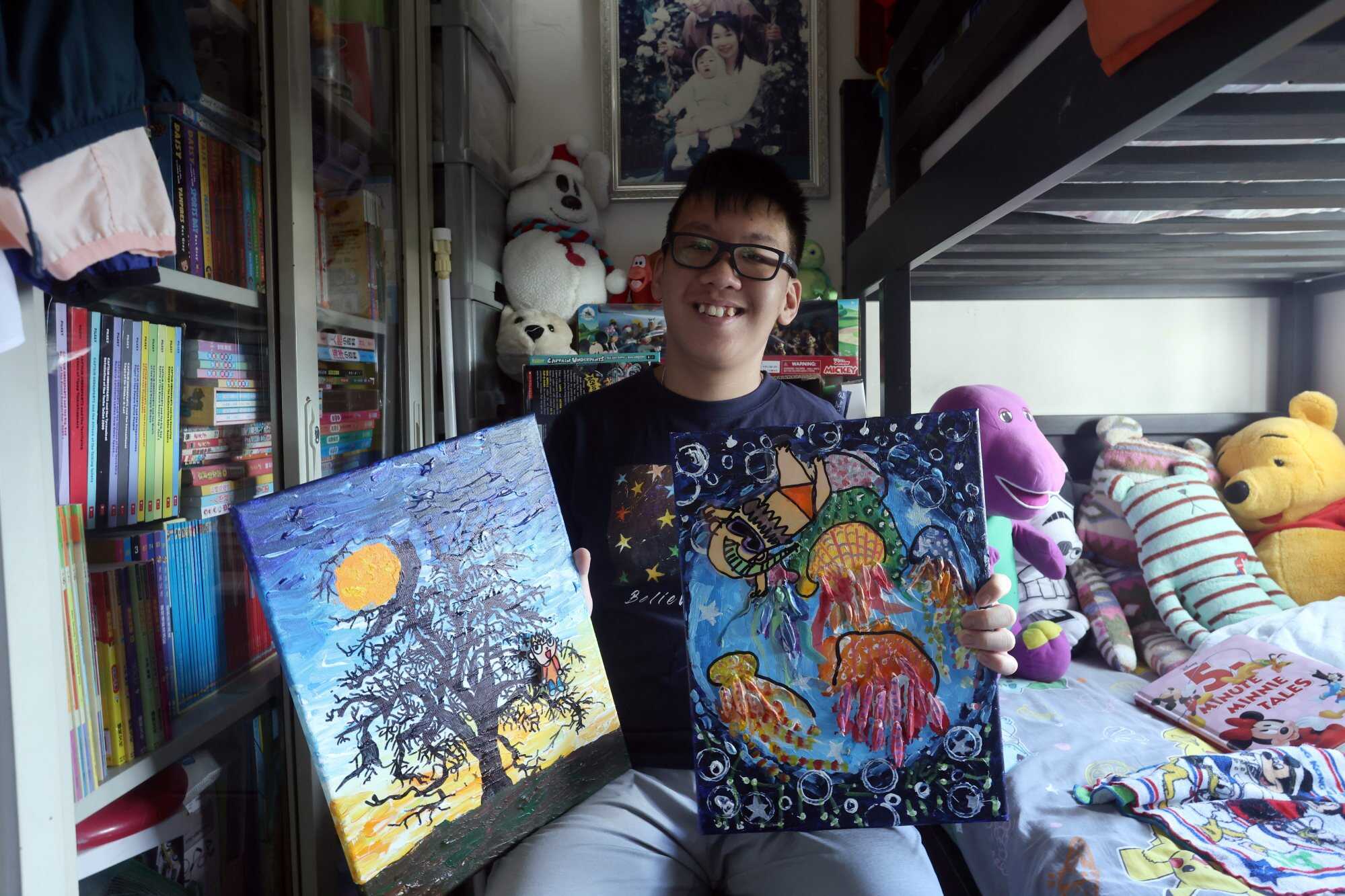 Jack poses with a few of his pieces at his home. Photo: Jonathan Wong