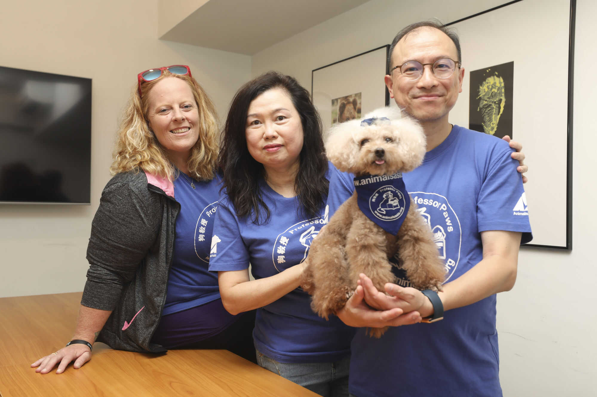 Animals Asia dog trainer Karina O’Carroll (from left) with Bear Bear’s guardians May Hung and Wong Hung-kuen. Photo: Xiaomei Chen
