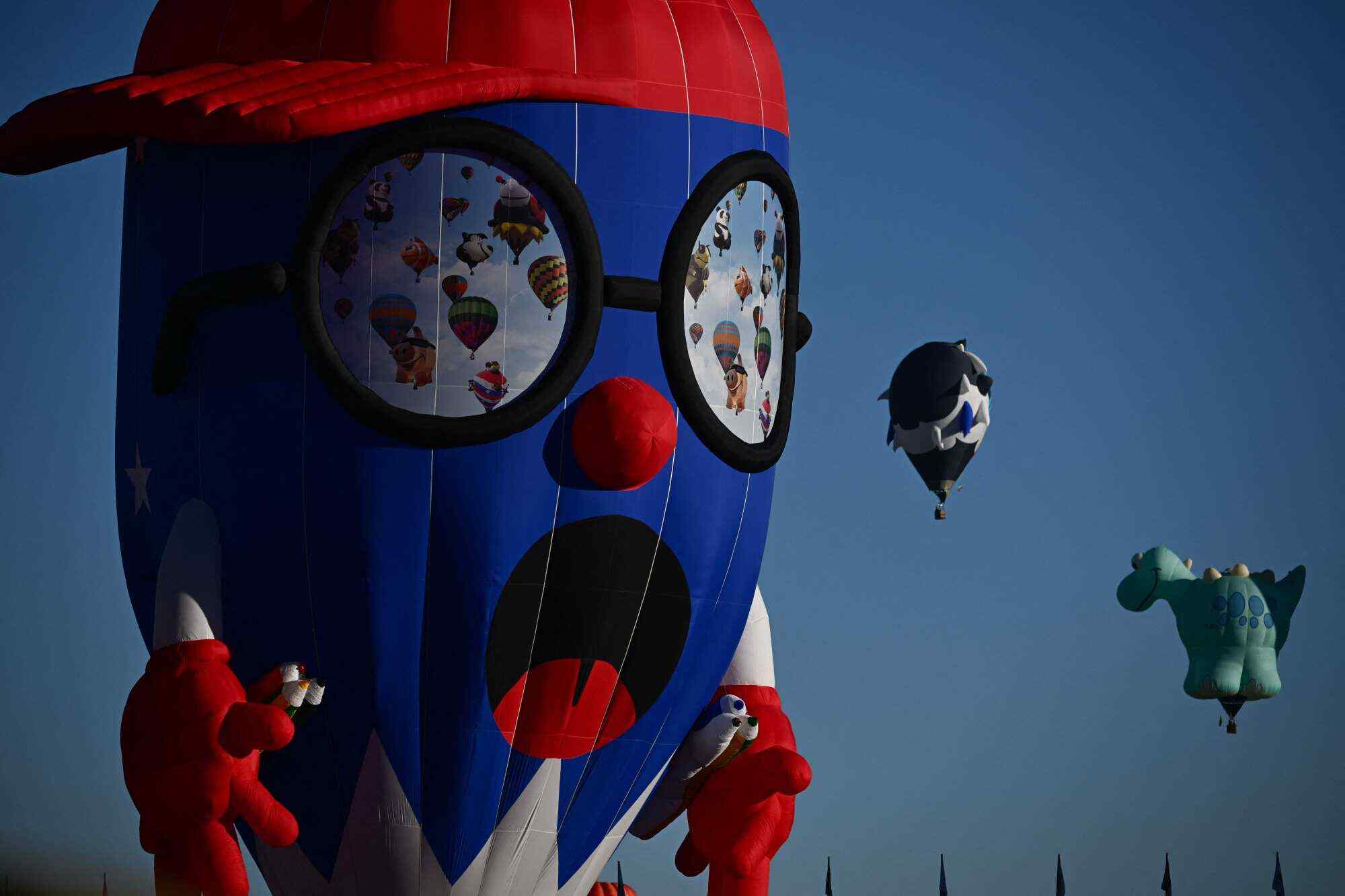 The Pencil Boy hot air balloon is inflated at sunrise during the Albuquerque International Balloon Fiesta in the US state of New Mexico. Photo: AFP