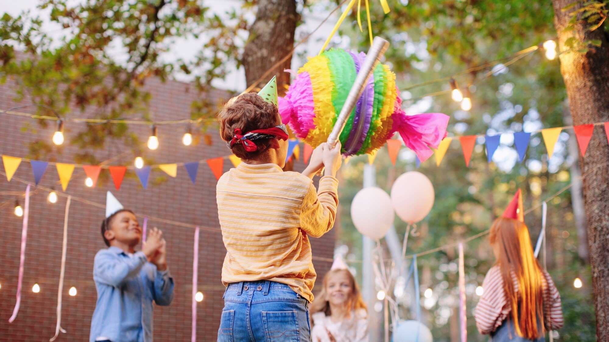 Take turns trying to break open the piñata. Photo: Shutterstock