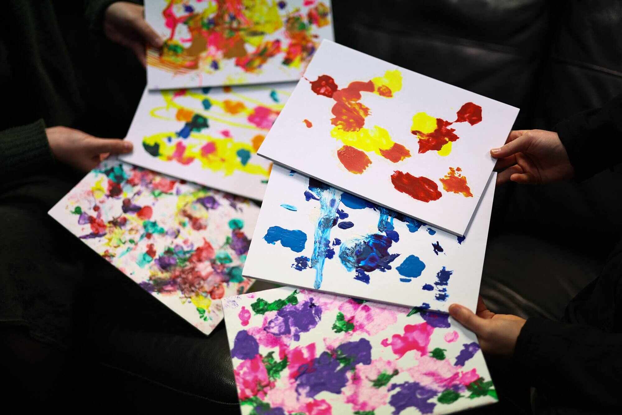 Paintings created by rescue dogs are pictured at the Bristol Animal Rescue Centre. Photo: AFP