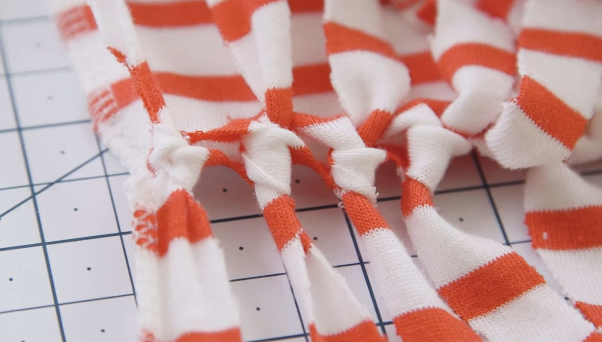 Tie the strips to make the bottom of the tote. Photo: Shutterstock