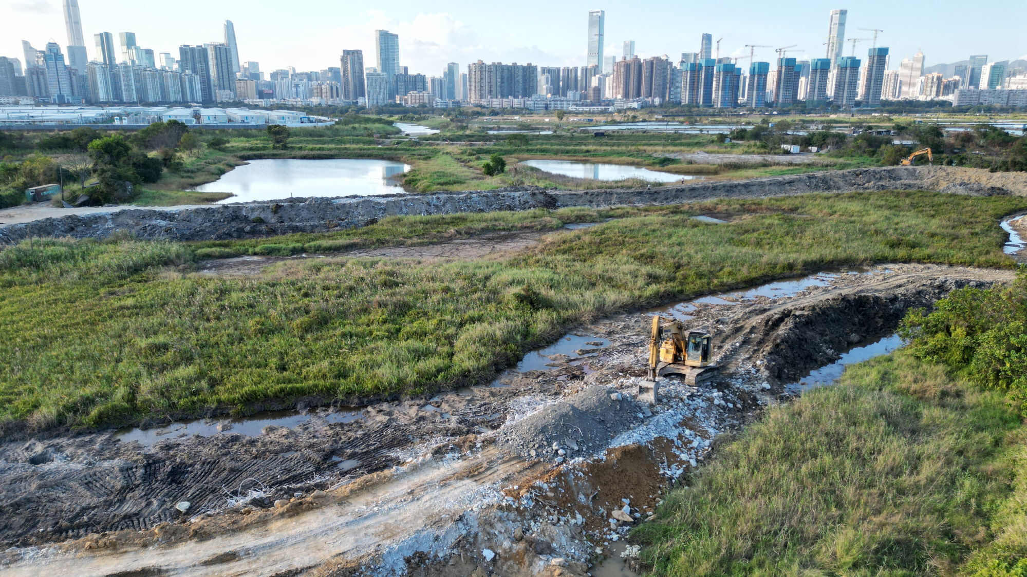 Several trucks have been spotted pouring dirt into the fish ponds. Photo: Dickson Lee
