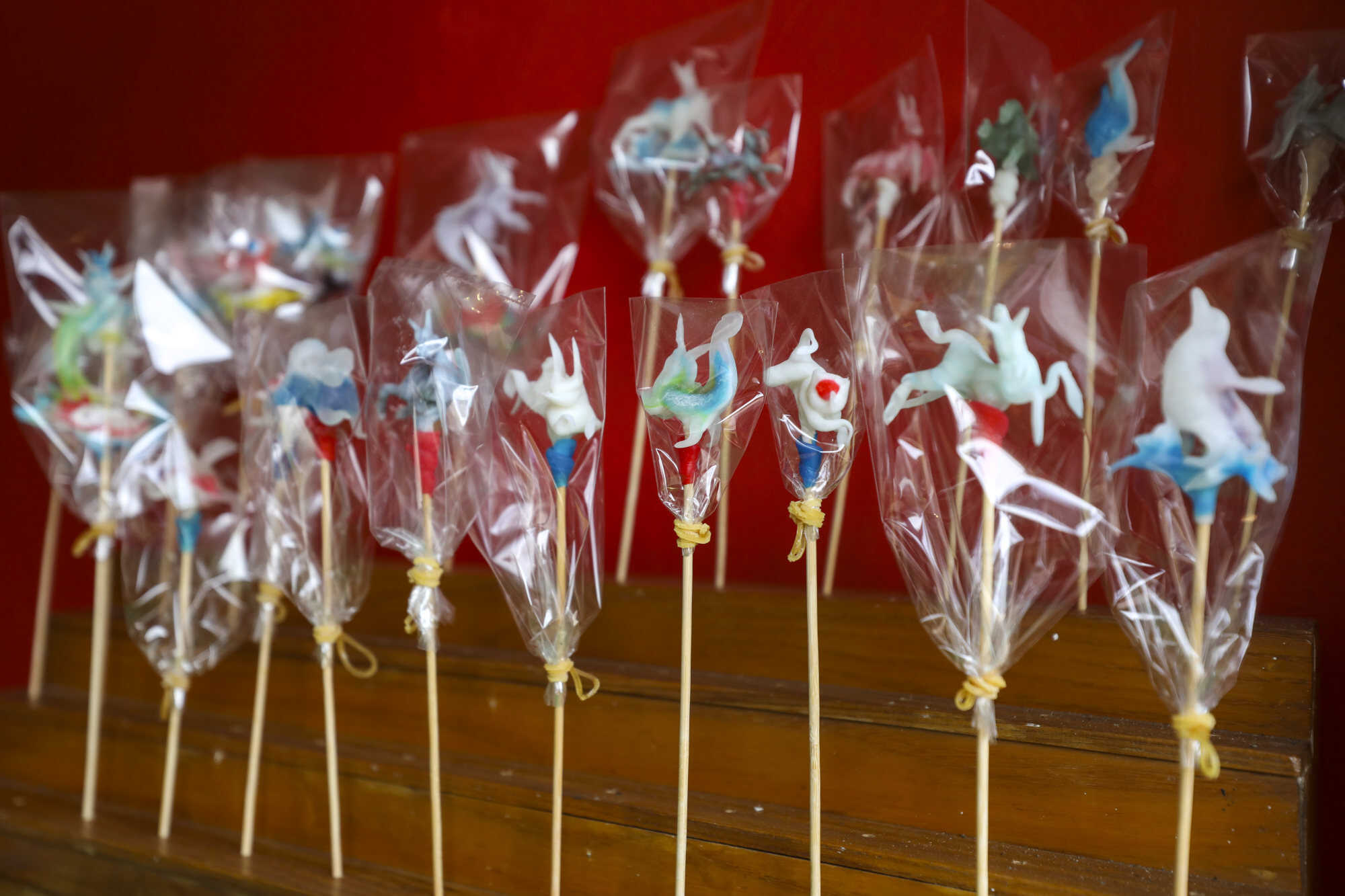 Each of these candies must be shaped within three minutes, before it becomes to hard to mould. Photo: Xiaomei Chen