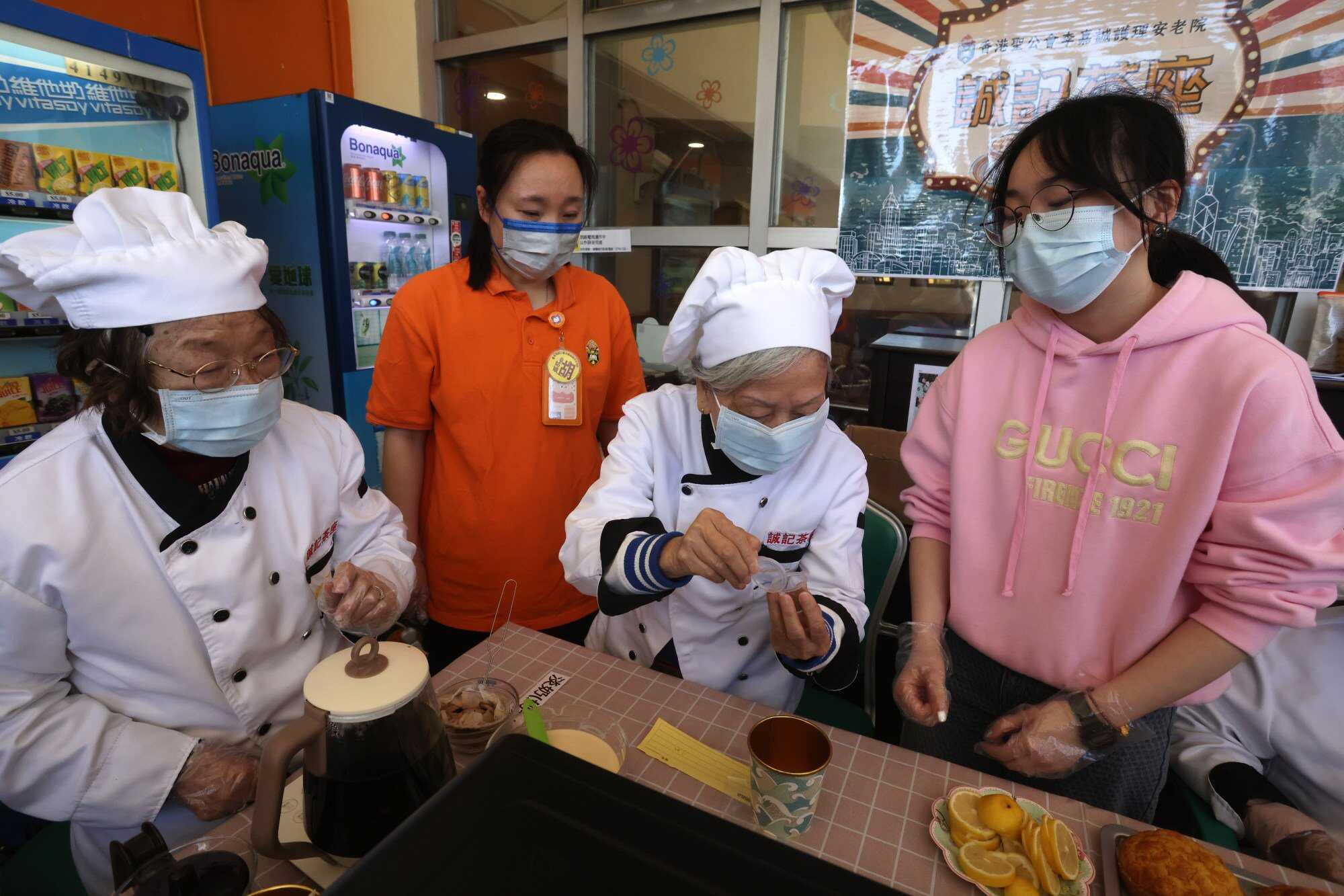 Residents of the care home take orders, cook food and serve customers at the Shing Kee Cafe. Photo: Jonathan Wong