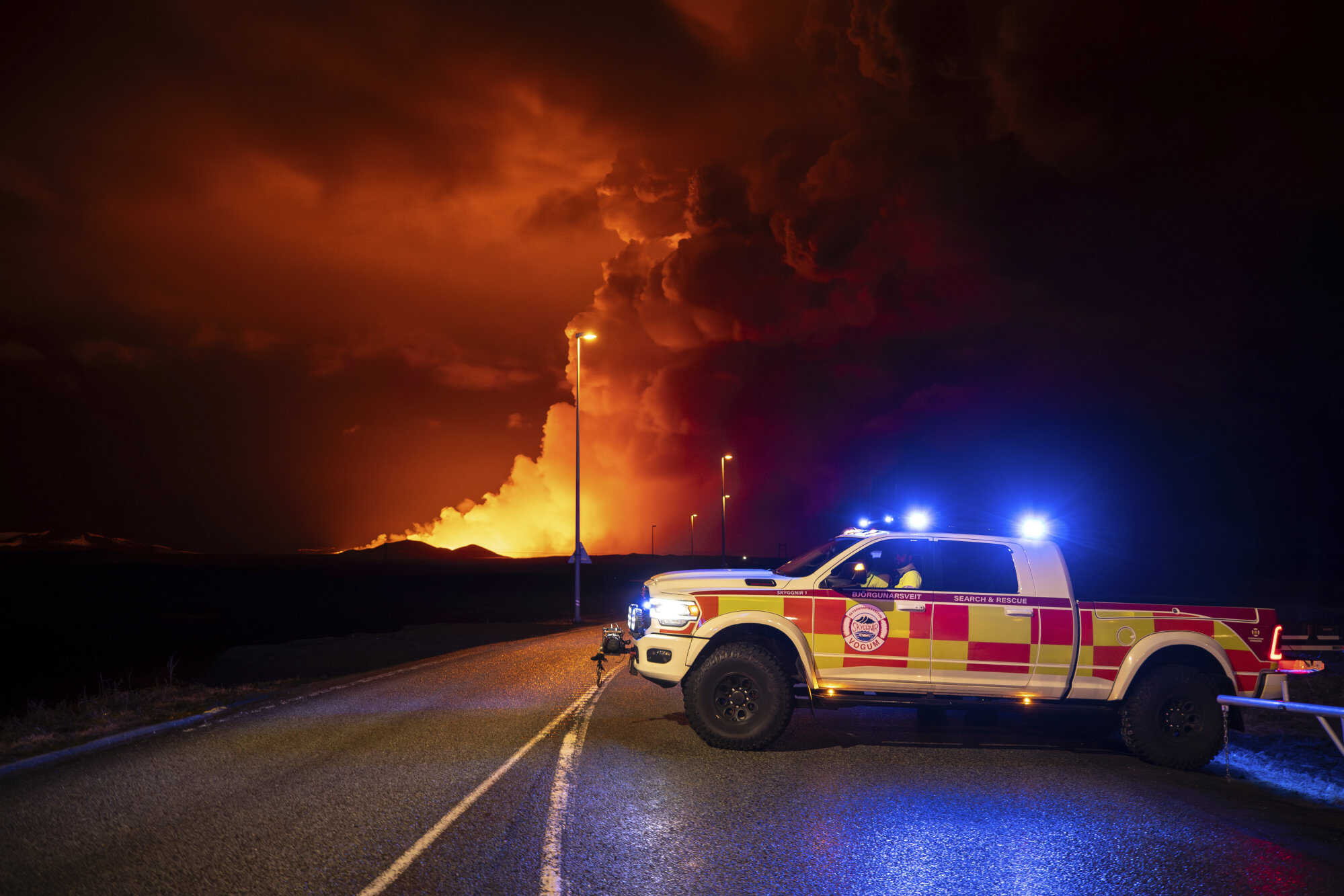 An emergency vehicle is stationed on a road leading to volcanic activity in Iceland. Photo: AP