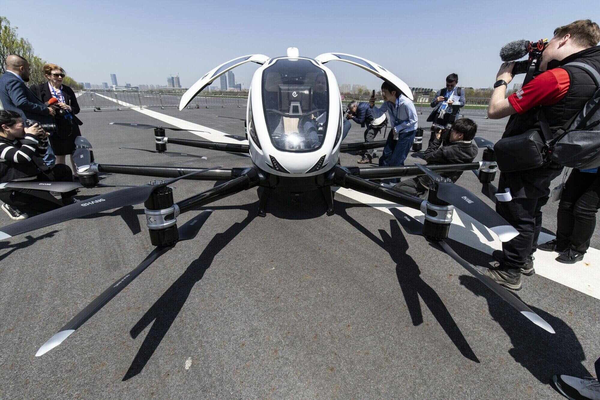 EHang’s passenger-carrying electric unmanned aerial vehicle has eight arms equipped with 16 propellers, each with its own electric motor. Photo: Bloomberg
