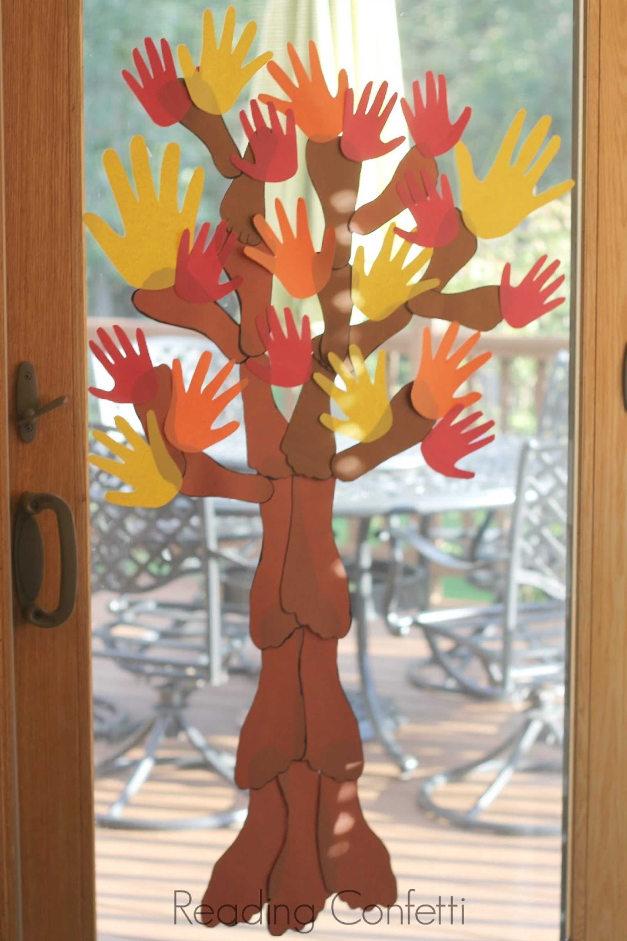 Make your own family tree using your hands, feet and construction paper! Photo: readingconfetti.com