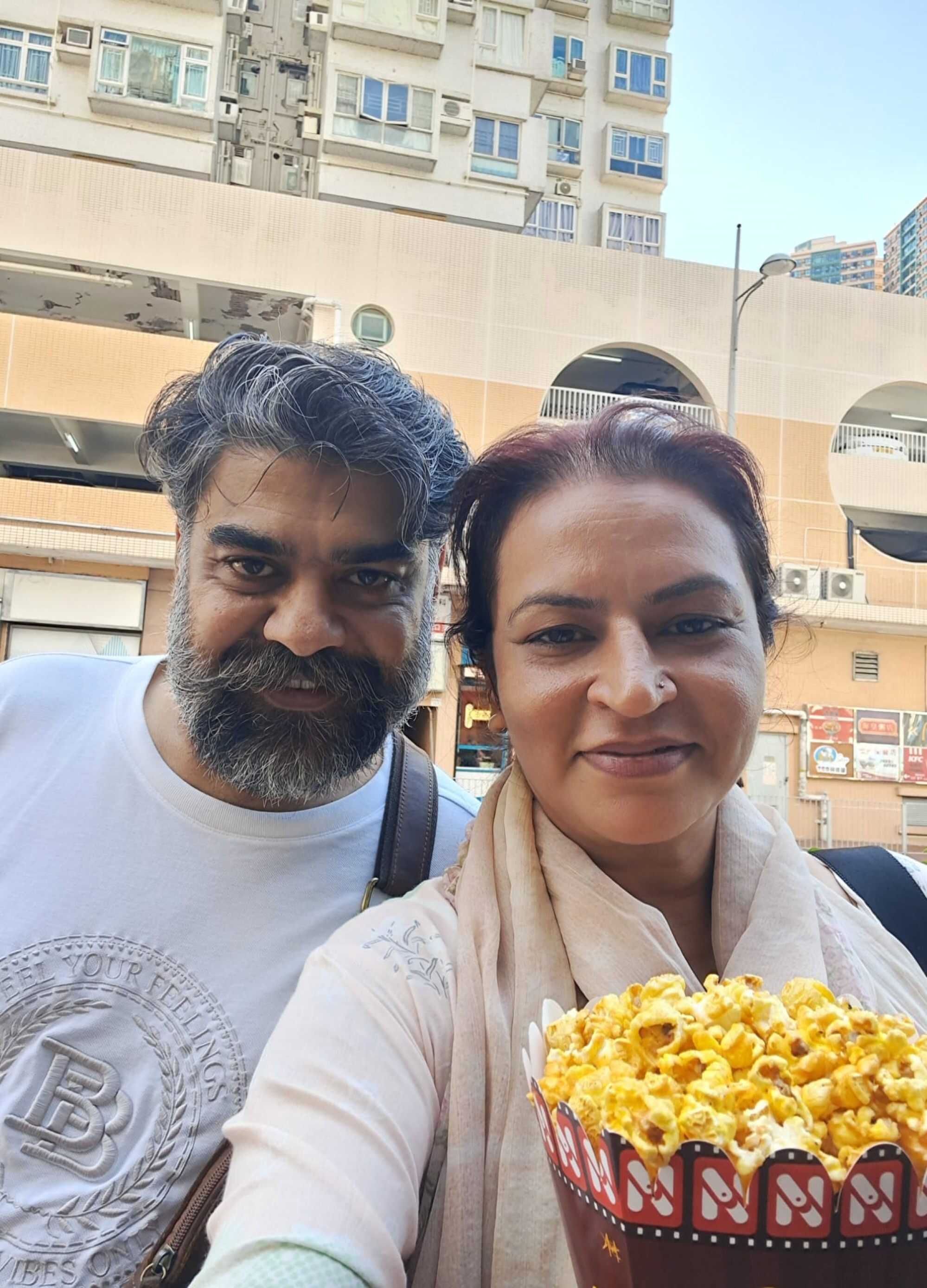 Farzana, Hong Kong’s only female bus driver from an ethnic minority background, with her husband. Photo: Handout