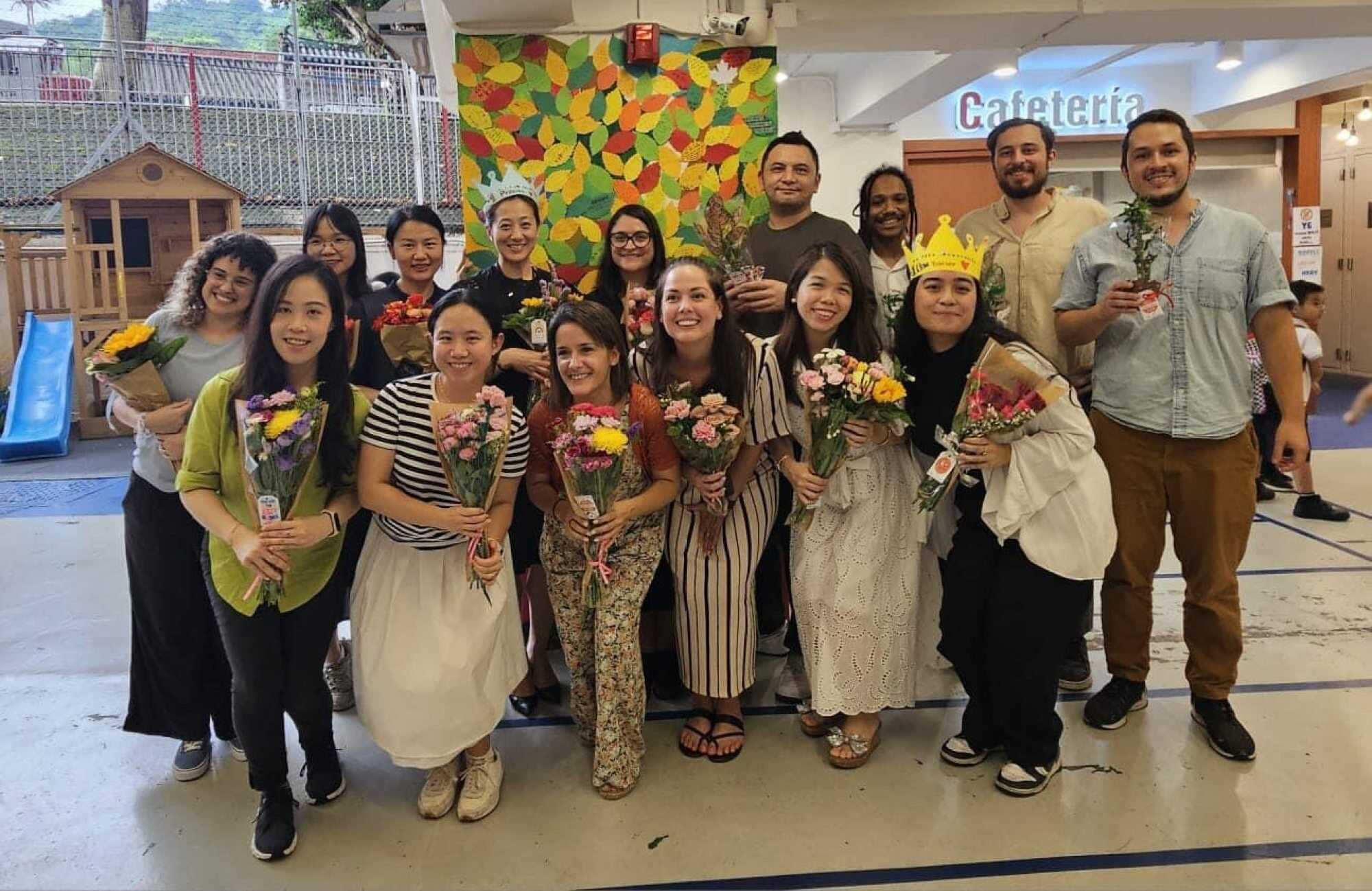 Teachers at Spanish School of Hong Kong stand next to their tree of compliments from students. Photo: Handout