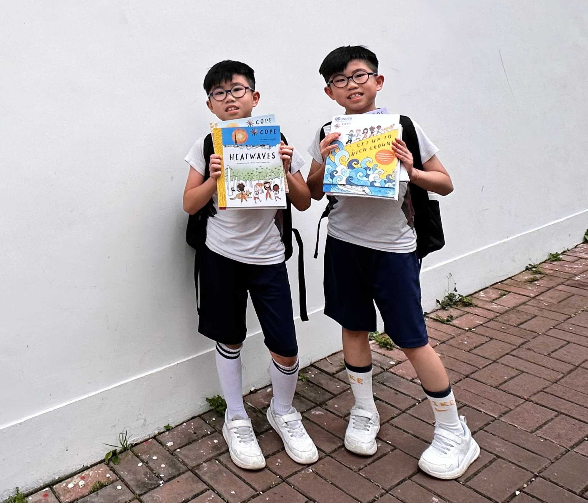 Skyler and Thyler recommend reading the COPE books. Photo: Handout