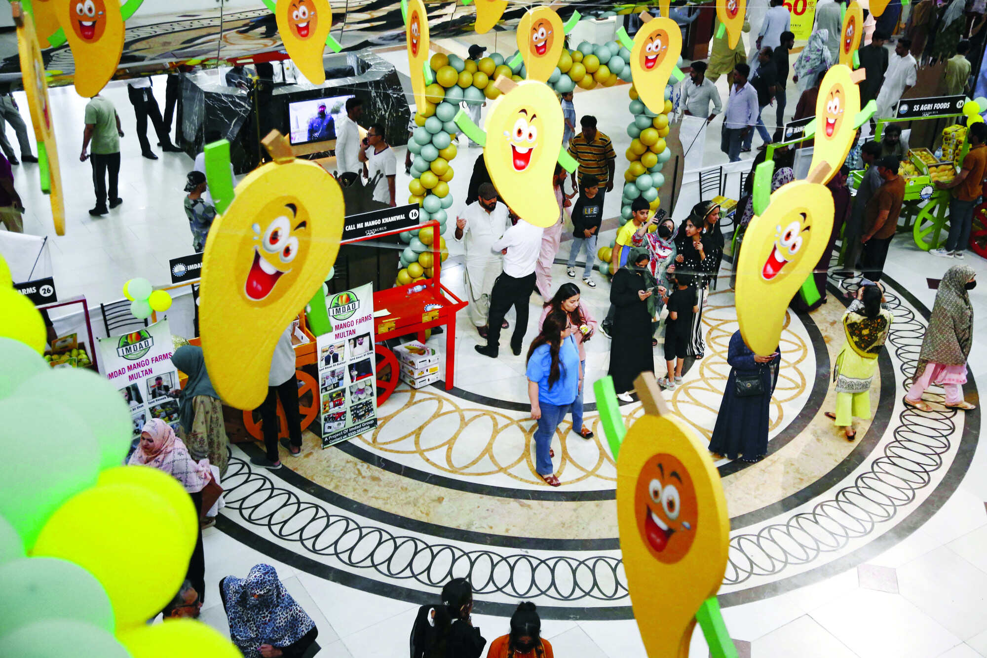 People visit a mango festival in Islamabad, Pakistan on July 7, 2024. Photo: Xinhua