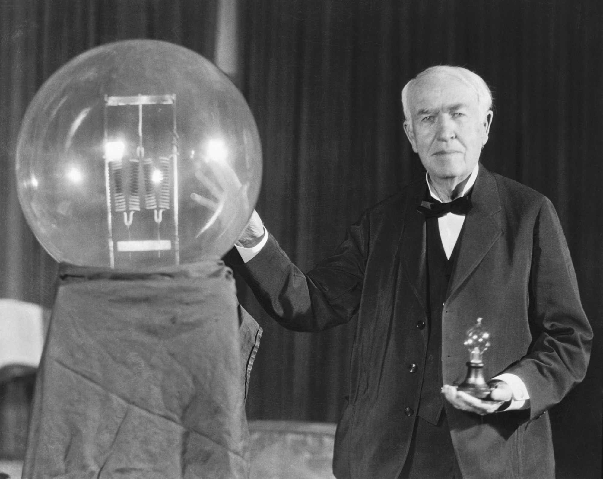 Thomas Edison exhibits a replica of his first successful incandescent lamp. Photo: Bettmann/CORBIS