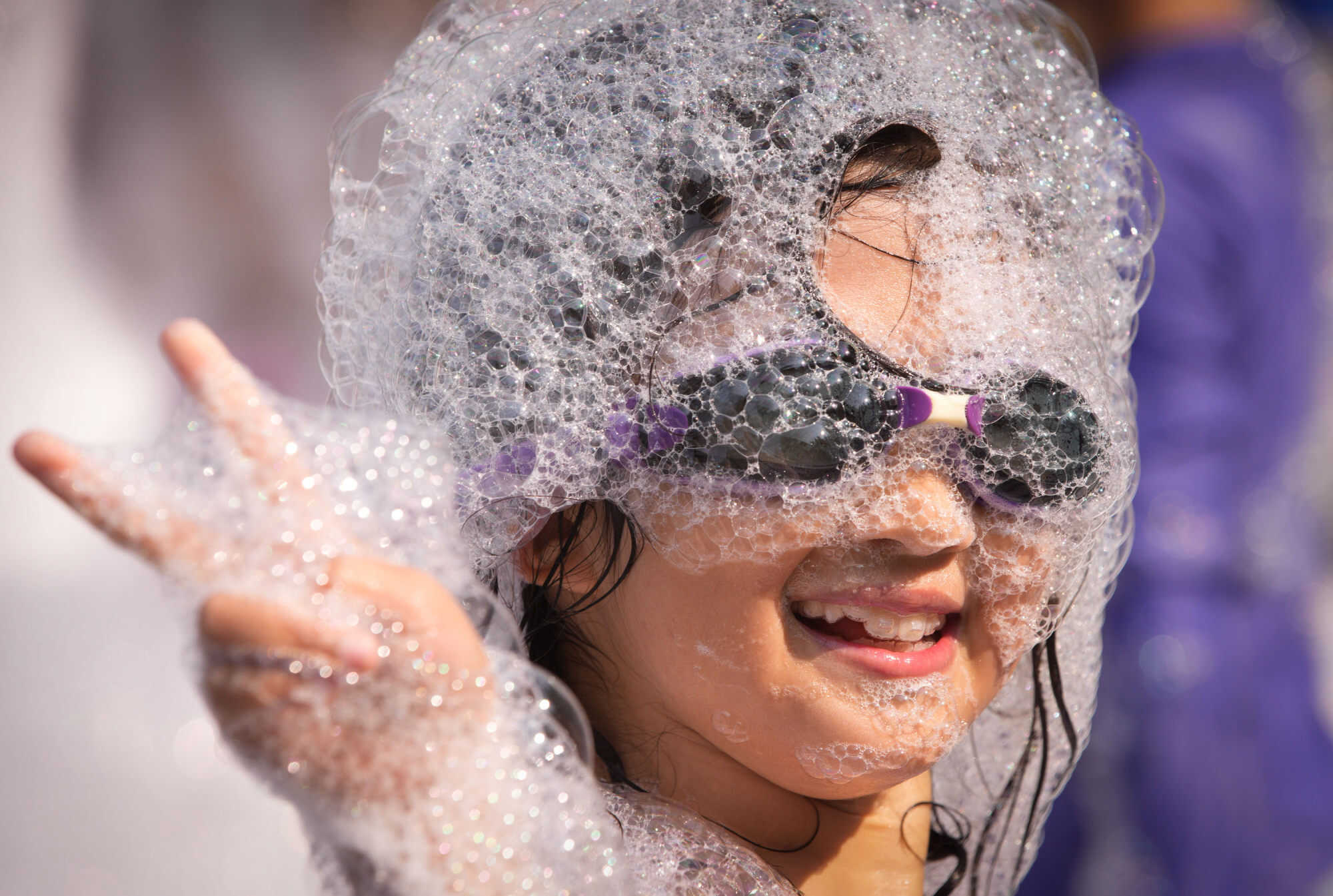 A girl poses for photos while having fun in the foam during the 2024 Chinese Cultural Heritage Festival and Vancouver Water Splashing Festival in Canada. Photo: Xinhua