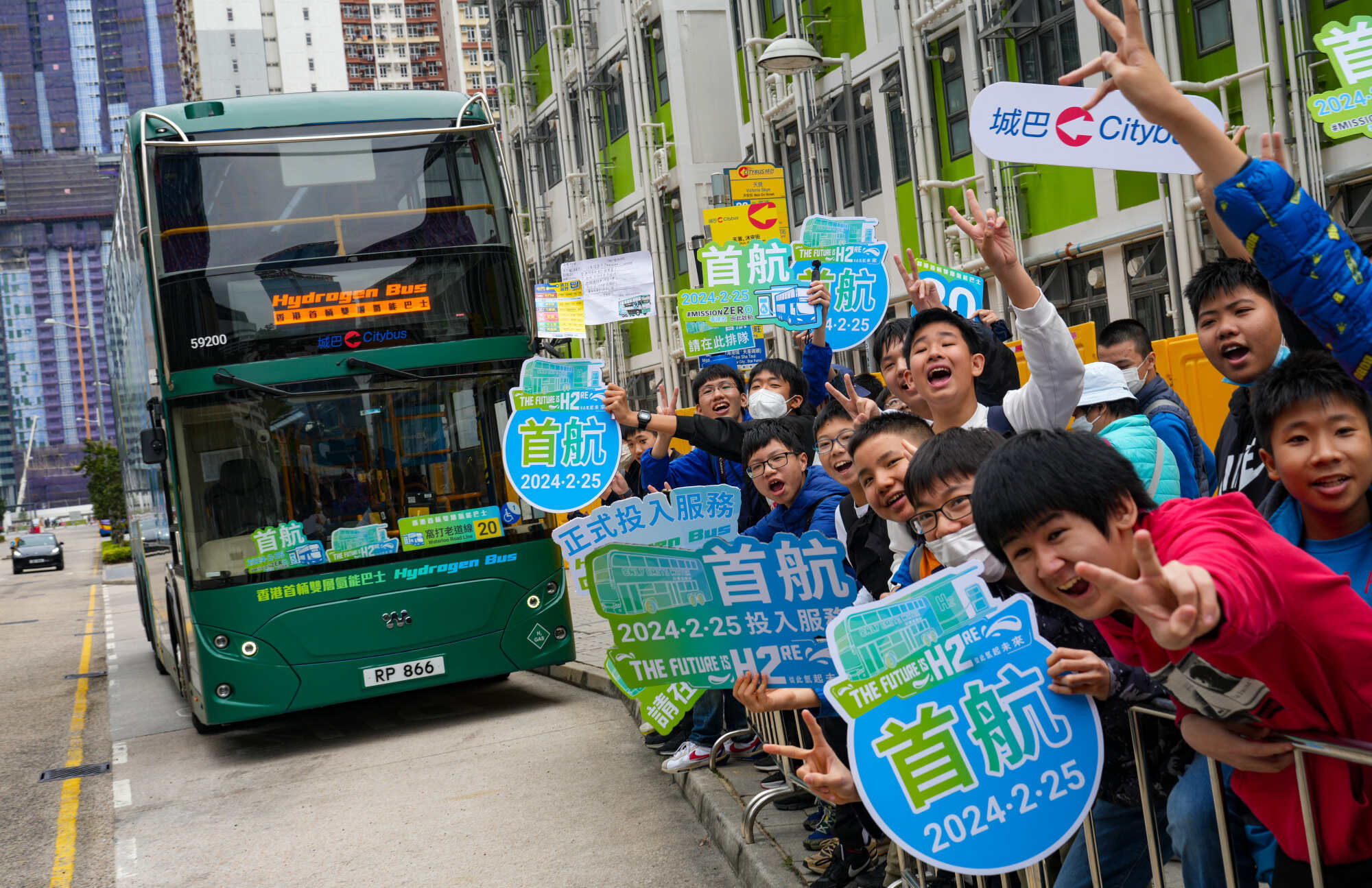 Dozens of bus fanatics, with some queueing hours in anticipation, cheer on board the maiden voyage of Hong Kong’s first hydrogen-powered double-deck bus. Photo: Sam Tsang
