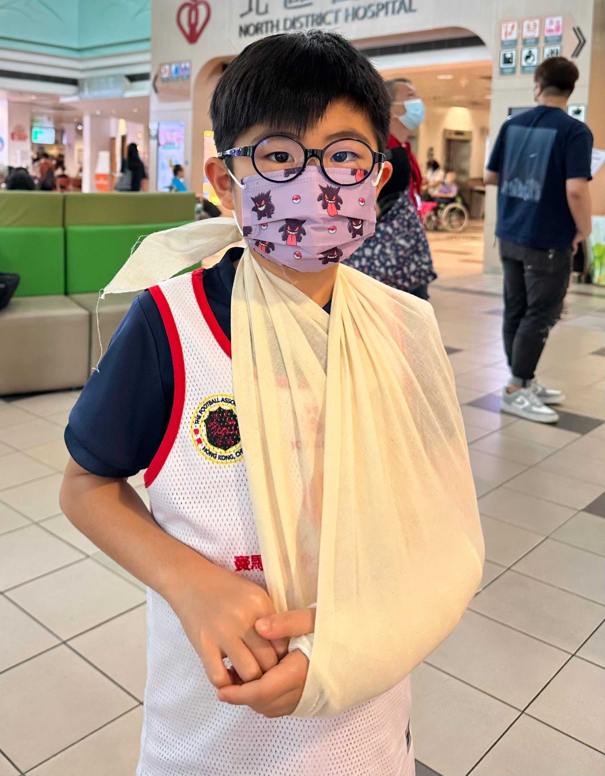 Thyler poses for a picture with his broken arm. Photo: Handout