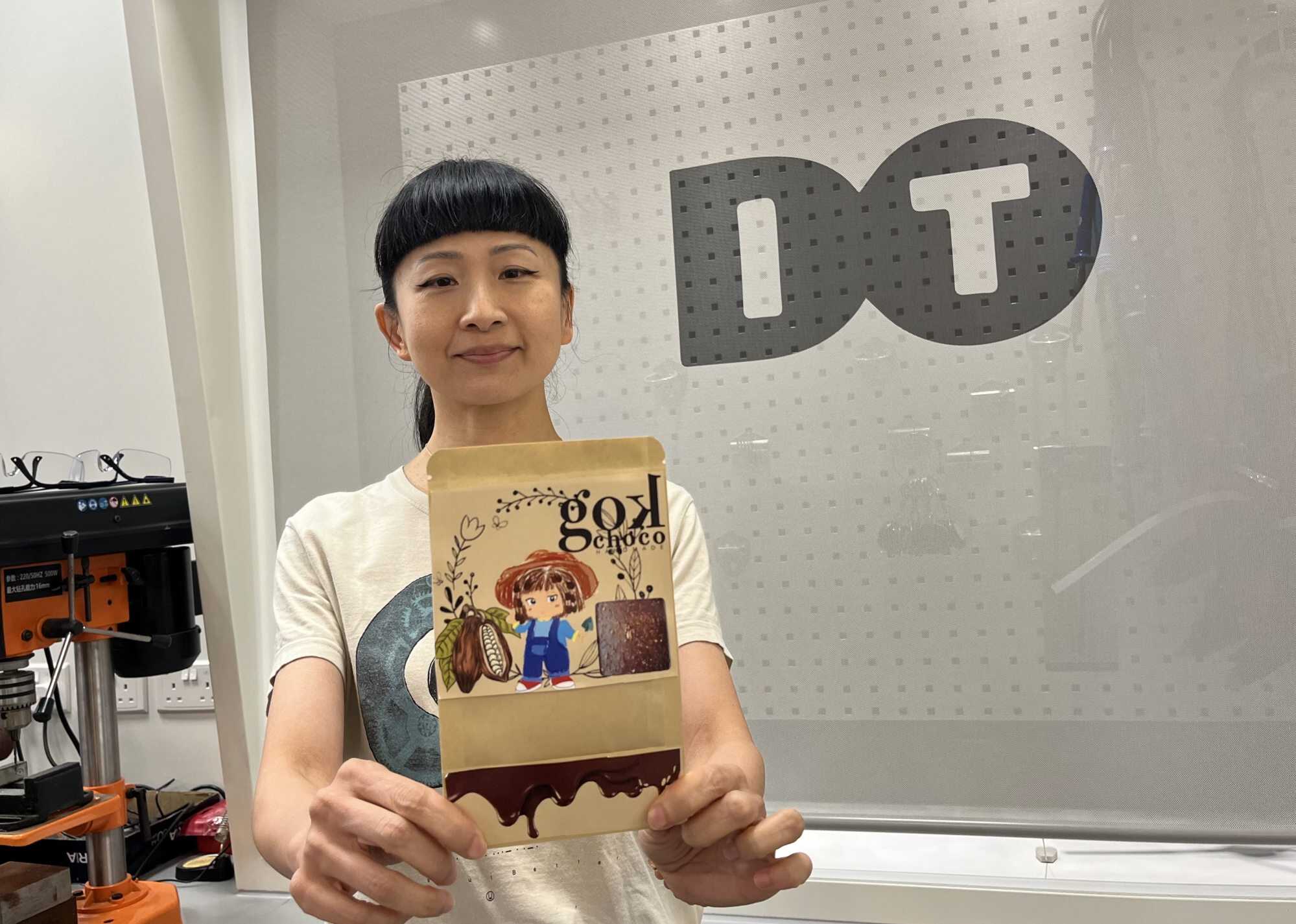 Yannie Lam, the founder of Gok3choco, holds the packaging that was designed by student Vincent Zhou. Photo: Kelly Fung