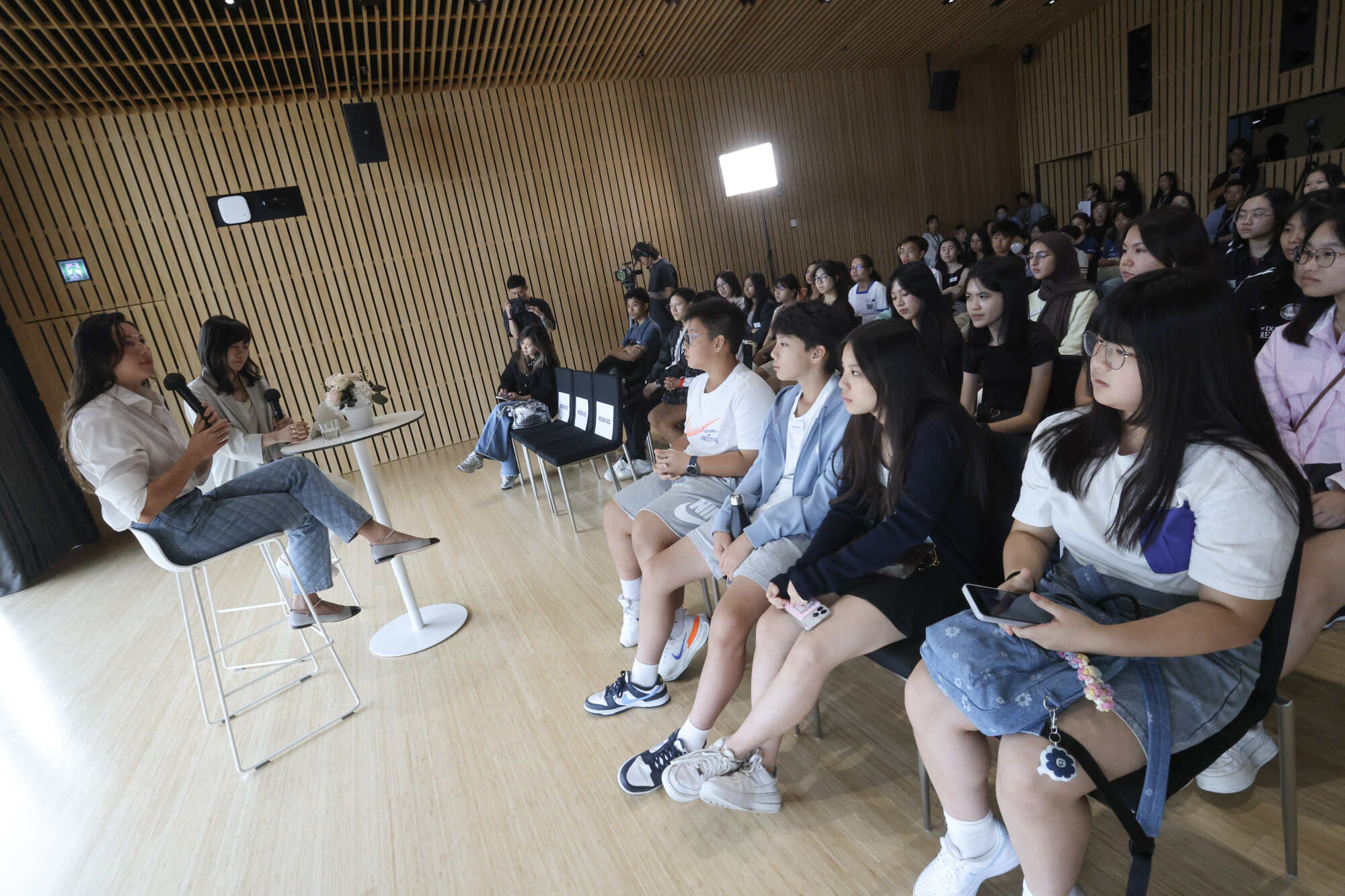 Olympian Siobhan Haughey (left) chatted with Hong Kong students this month in a forum moderated by Young Post editor Emily Tsang (second from left). Photo: Jonathan Wong