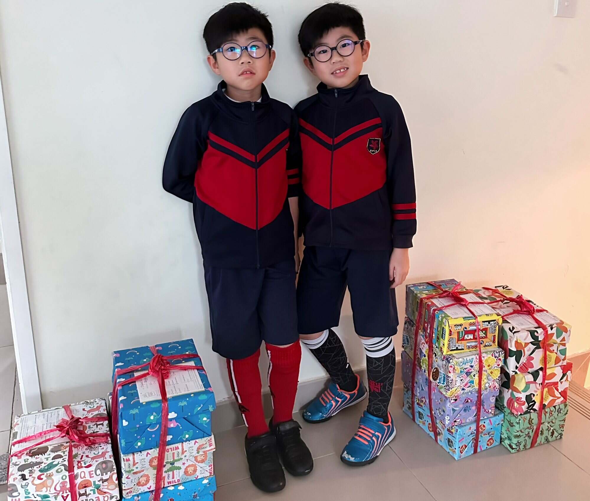 Skyler and Thyler Ng talk about the deadly floods in Spain. Photo: Handout