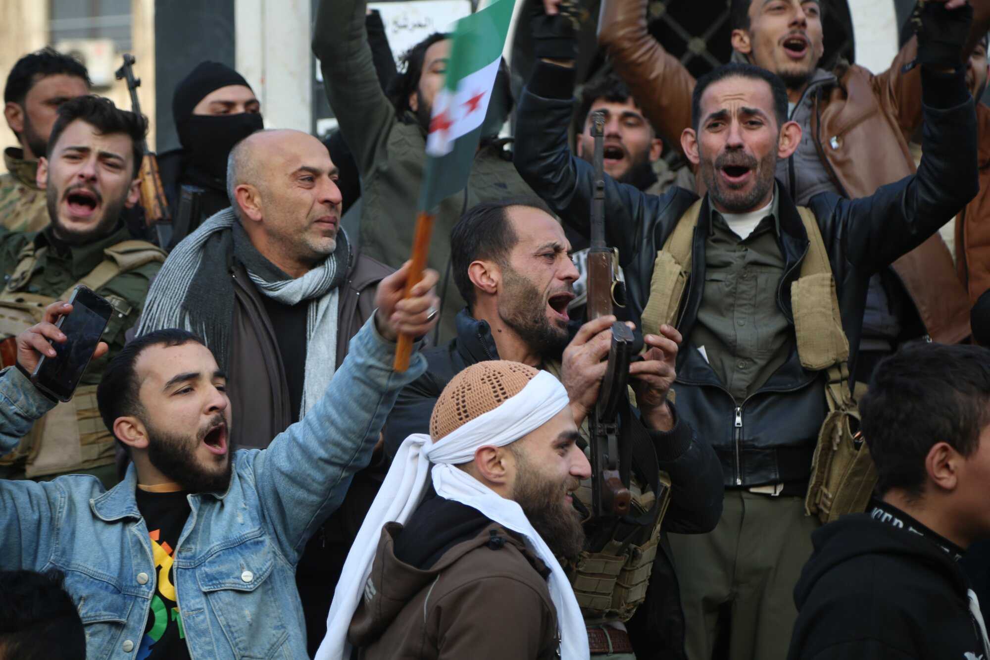 Syrian rebels celebrate following the takeover of Damascus, in Homs, Syria. Photo: EPA-EFE