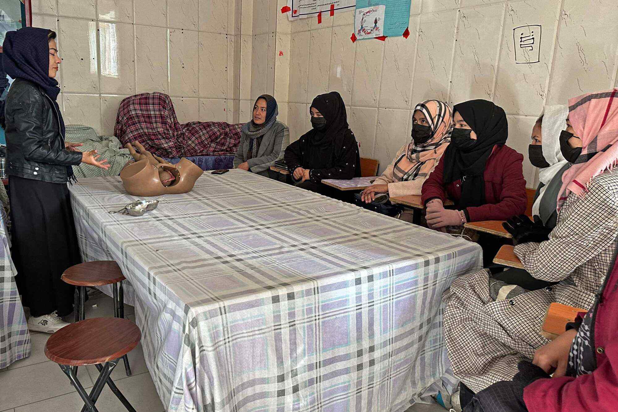 Women attend a class at an institute of health sciences in Ghazni, Afghanistan. Photo: AFP