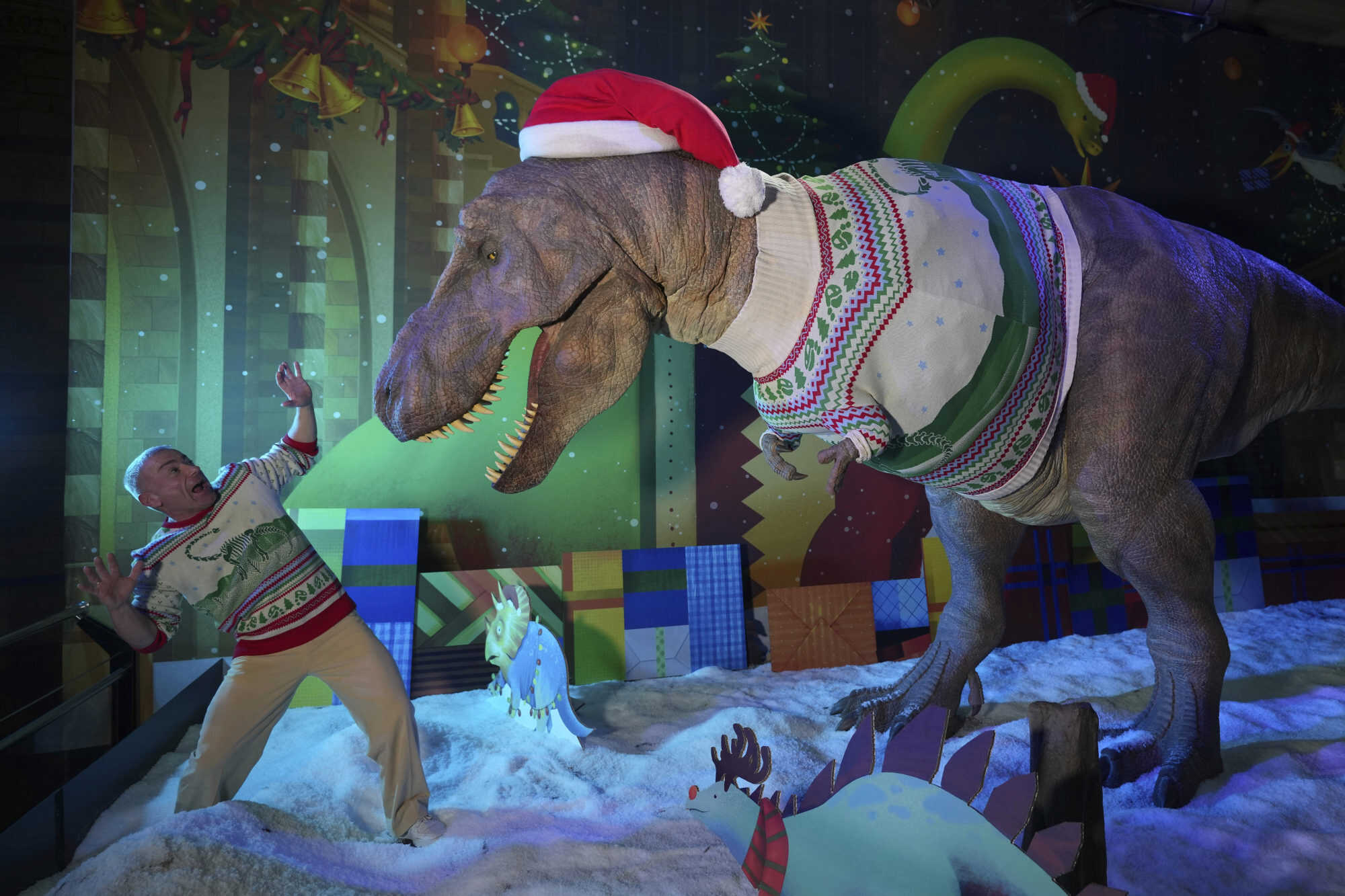 The animatronic T. rex at the Natural History Museum unveiled its 2024 Christmas jumper. Photo: AP