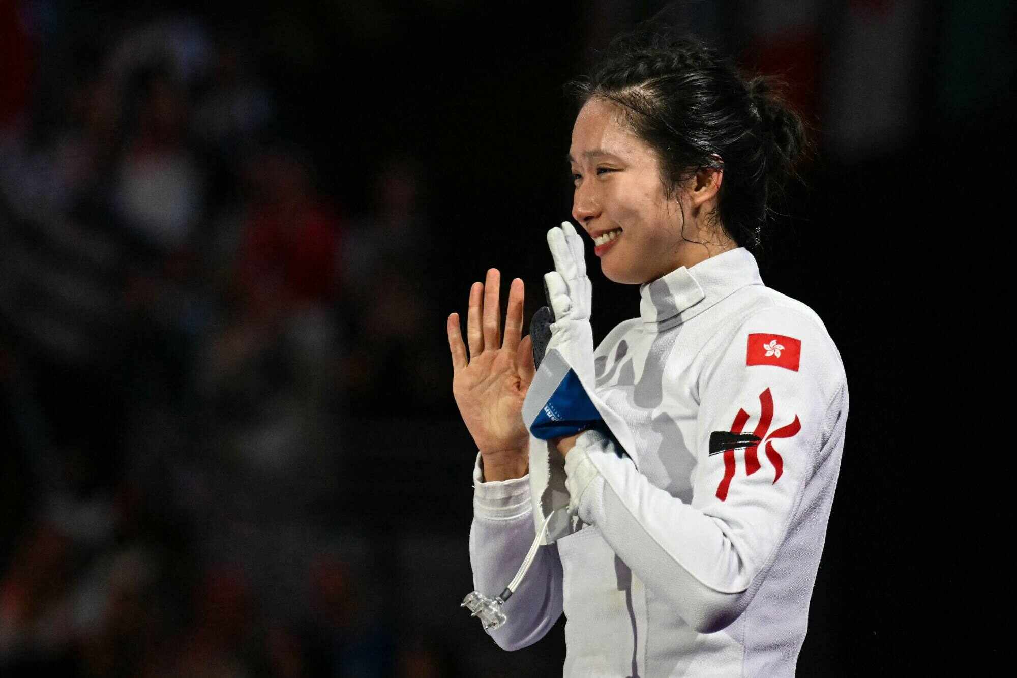 Vivian Kong celebrates after winning against France’s Auriane Mallo-Breton in the women’s épée individual gold medal bout during the Paris 2024 Olympic Games. Photo: AFP