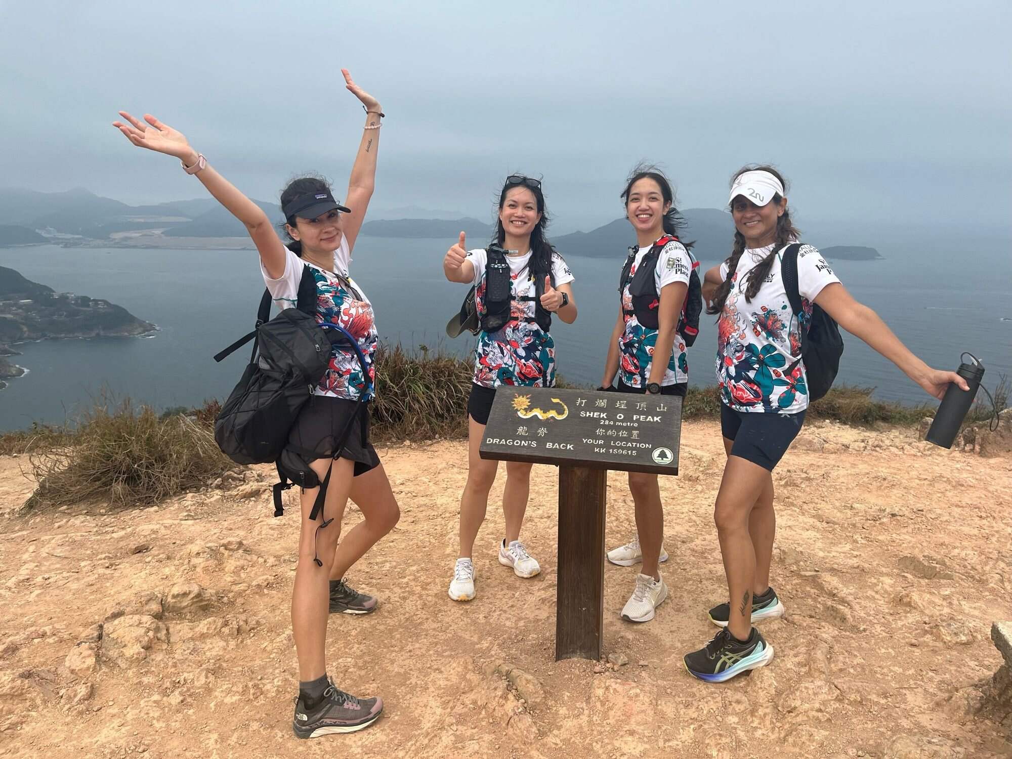 Participants of Weez Walk 2024 celebrate their hiking success on Dragon’s Back. Photo: Handout