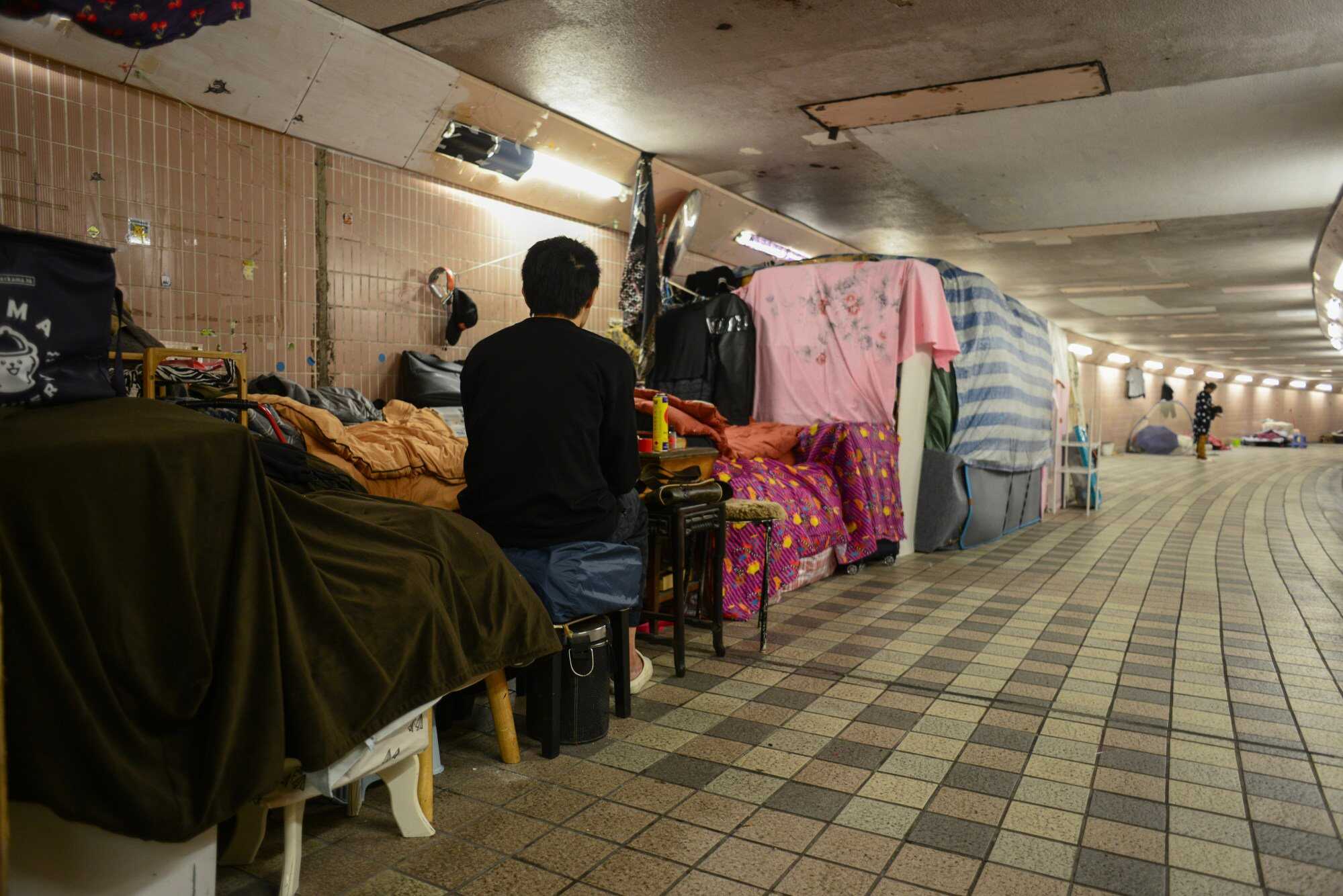 The homeless in Hong Kong sought shelter as temperatures dropped in January, with the government providing temporary relief. Still, some were left shivering outdoors. Photo: Antony Dickson