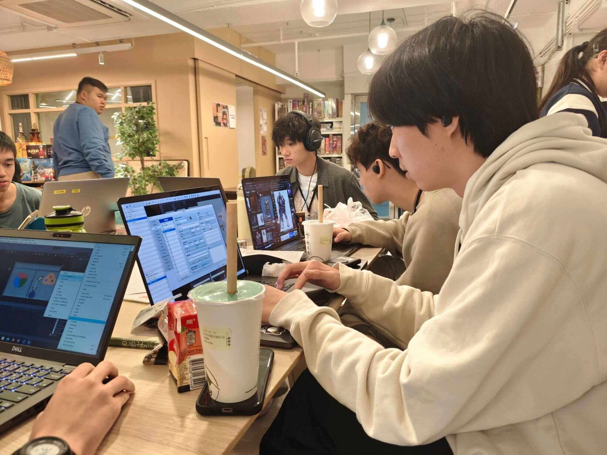 Andy Liang (left), Jay Lau (centre) and Theo Zhu (right) hard at work during the game jam. Photo: Handout
