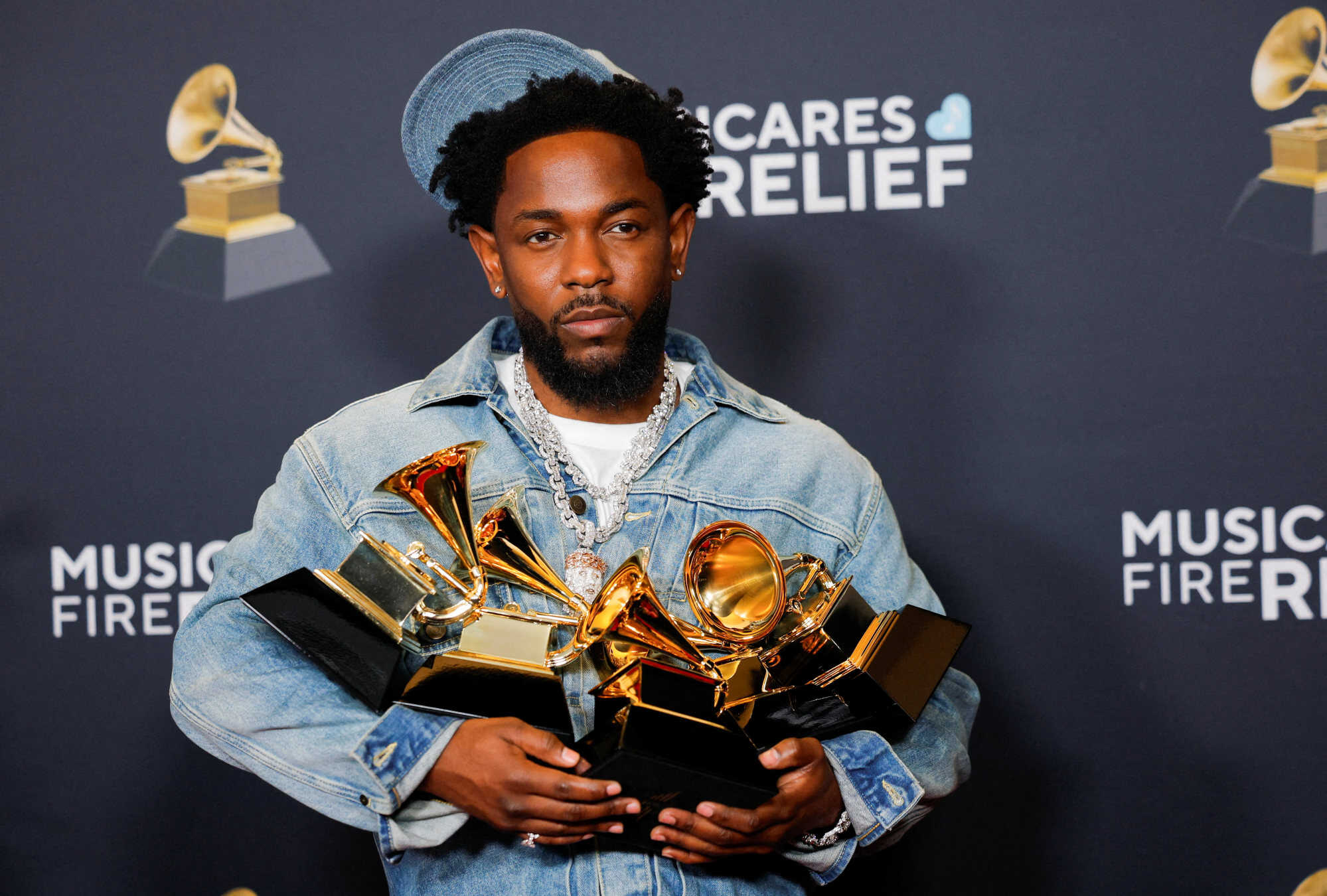 Kendrick Lamar, winner of the Record Of The Year, Best Rap Performance, Best Rap Song, Best Music Video and Song Of The Year awards, poses in the press room. Photo: Reuters