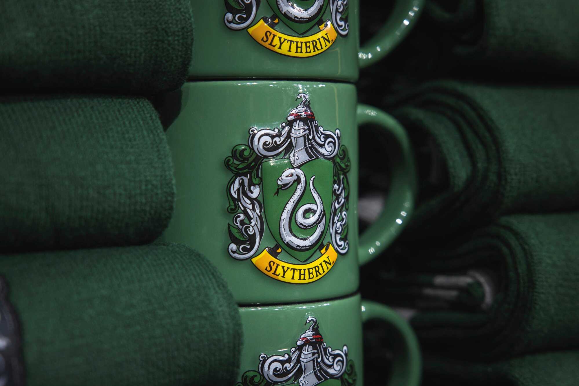 The Slytherin logo is seen on cups at “Harry Potter The Exhibition” in Barcelona, Spain. Photo: Getty Images