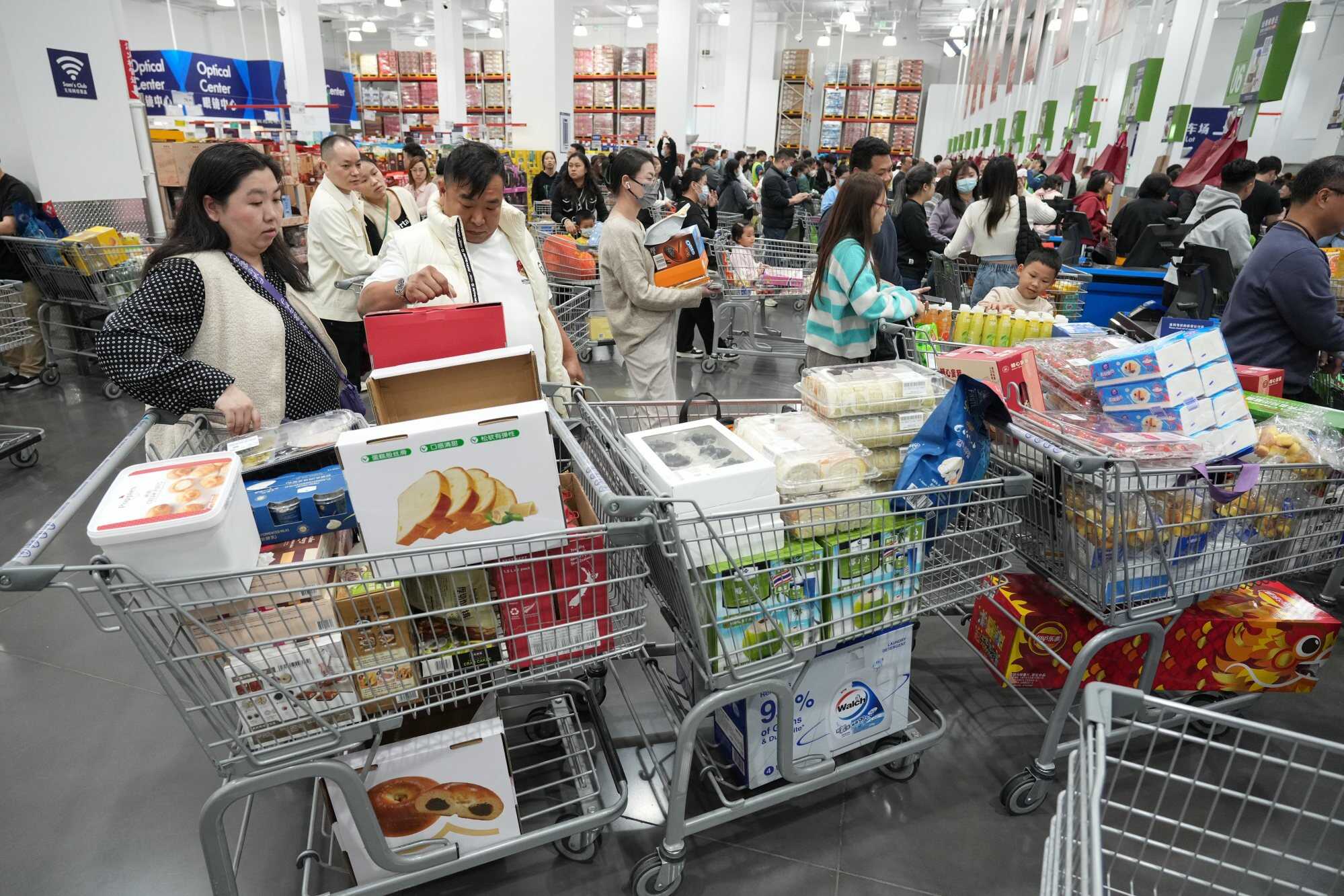 Shoppers from Hong Kong buy multiple carts of goods at Sam’s Club in Shenzhen. Photo: Eugene Lee