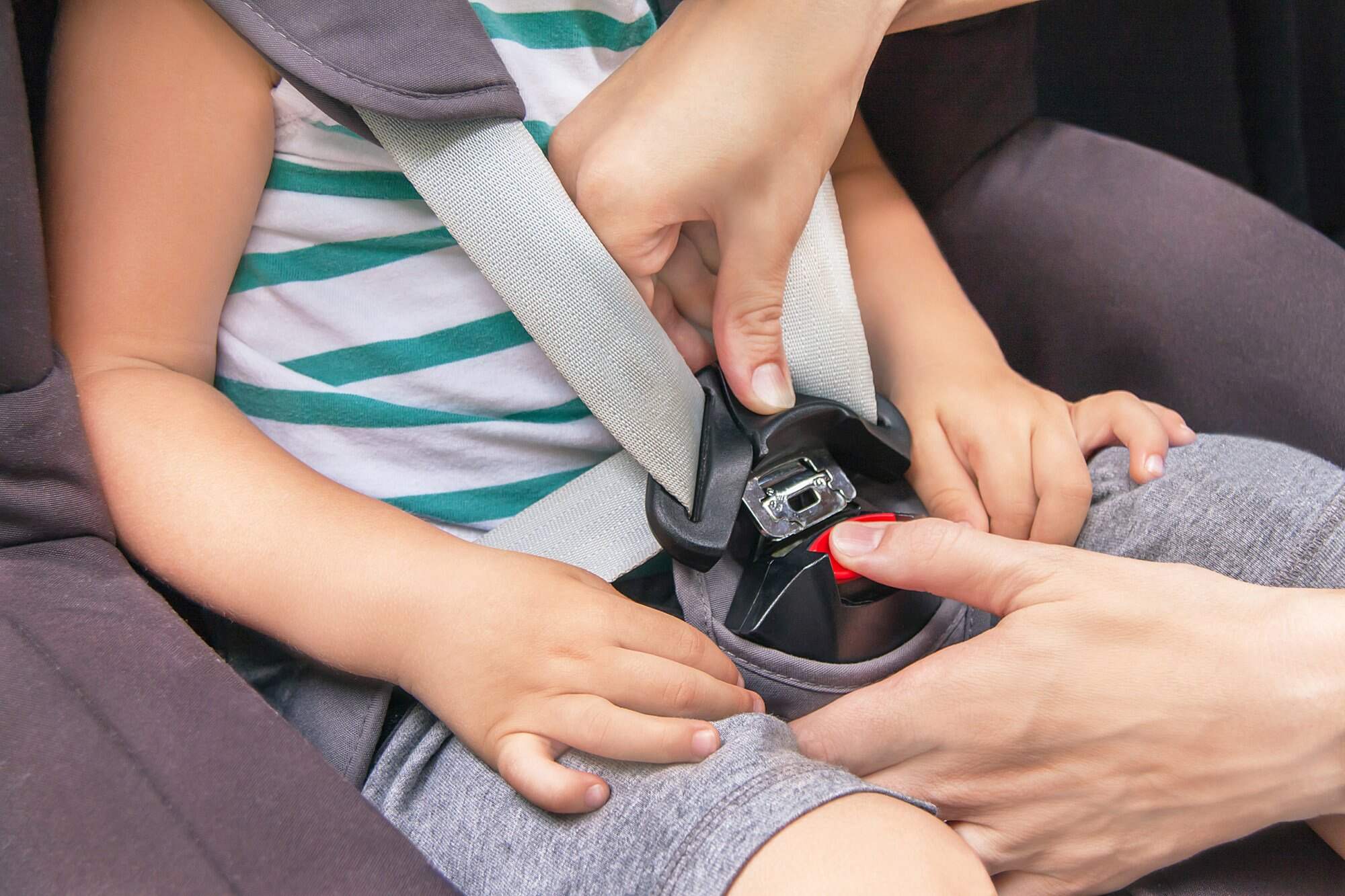 Child car seats and other safety devices protect young passengers, reducing the risk of injury. Photo: Shutterstock