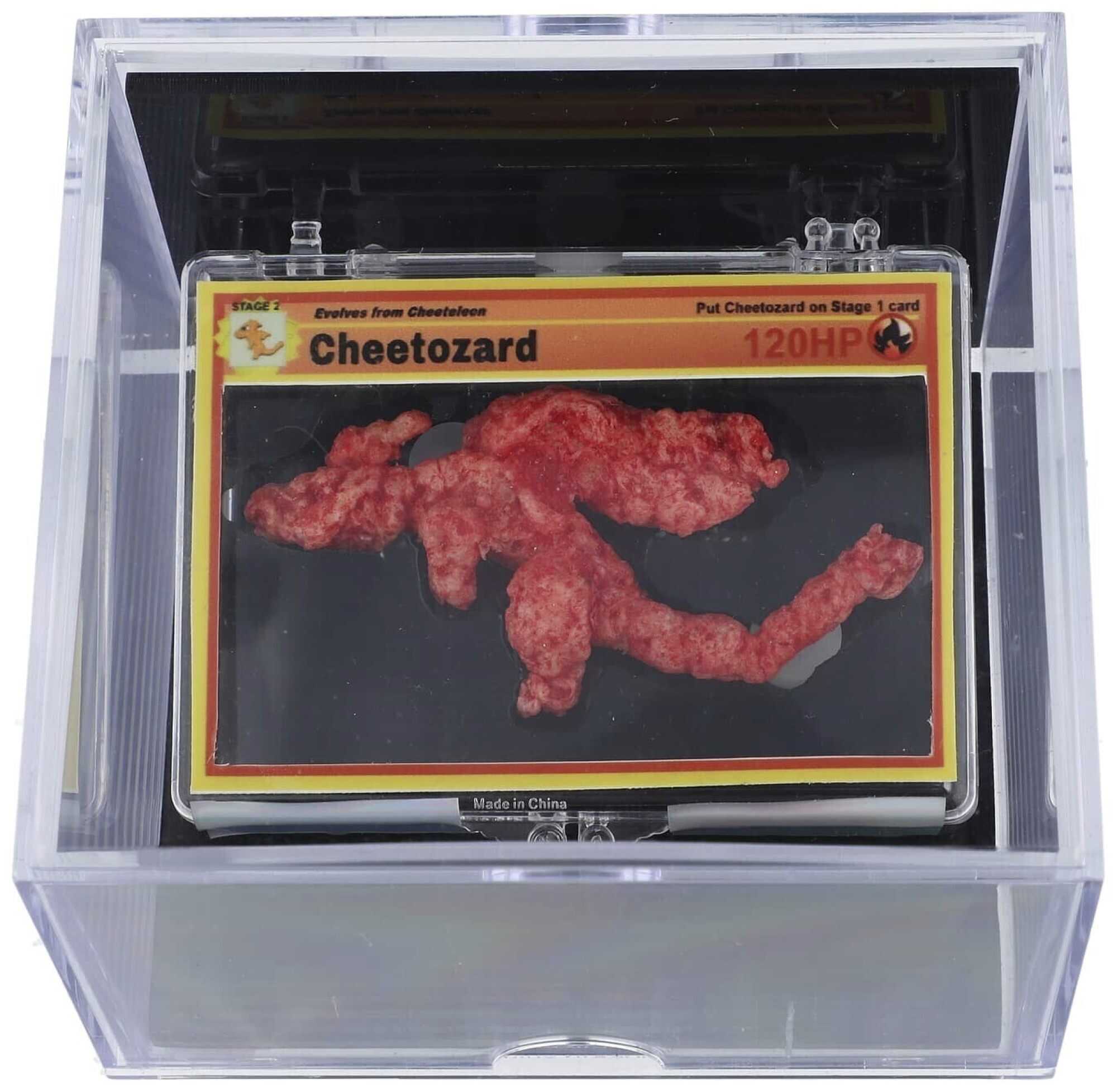 A Cheeto shaped like the Pokémon Charizard has fetched US$87,840 at an auction. Photo: AP