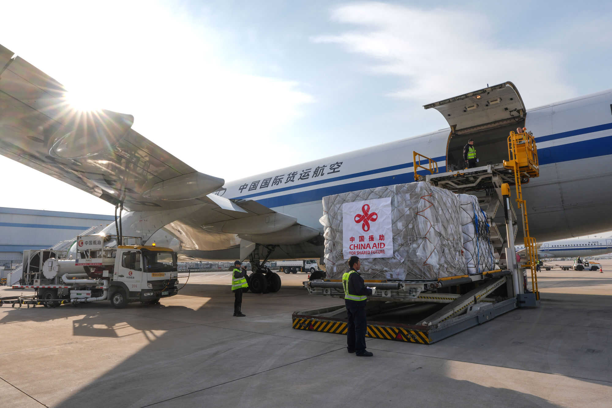 Staff members load China’s first batch of emergency humanitarian aid to Myanmar onto an plane at Beijing Capital International Airport. Photo: Xinhua