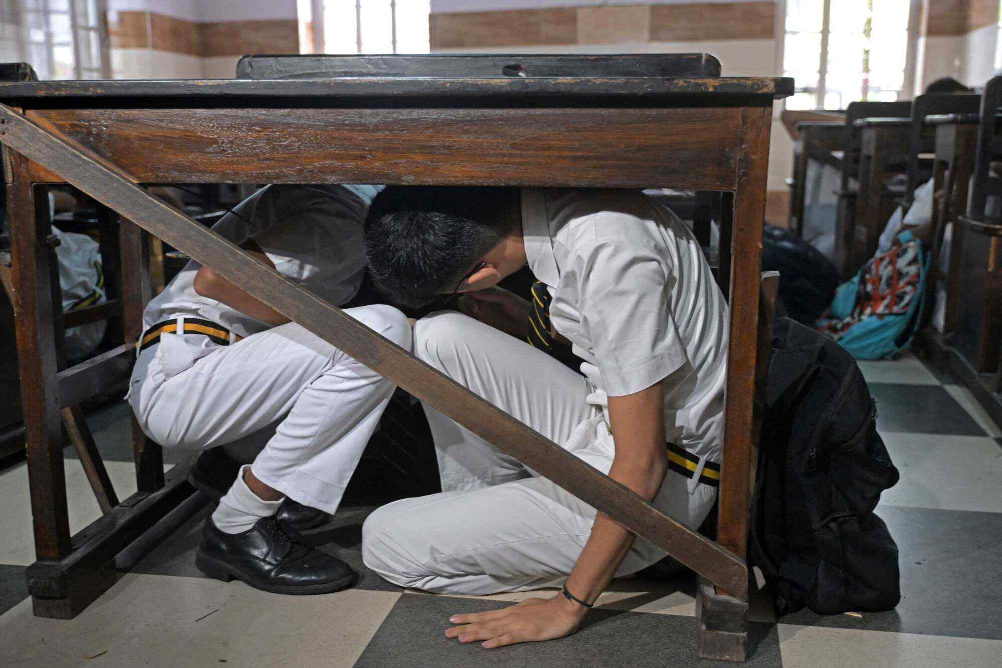 Students take part in an emergency simulation drill as part of the nationwide civil defence mock drill at a school in Kolkata on May 7, 2025, as border tensions surge. Photo: AFP