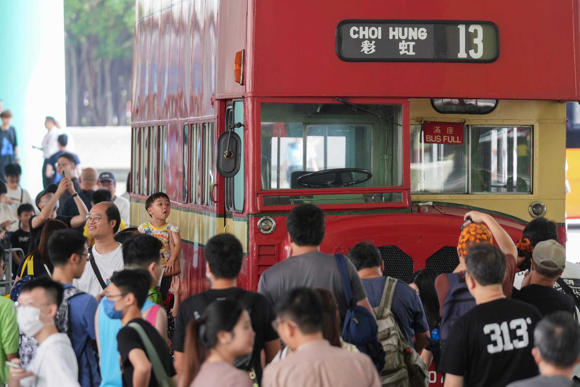 More than a hundred bus fans and onlookers gathered at Choi Hung Bus Terminus to see the retro AEC Regent 5 buses that ran between 1962 and 1966 by Kowloon Motor Bus (KMB). Photo: Eugene Lee
