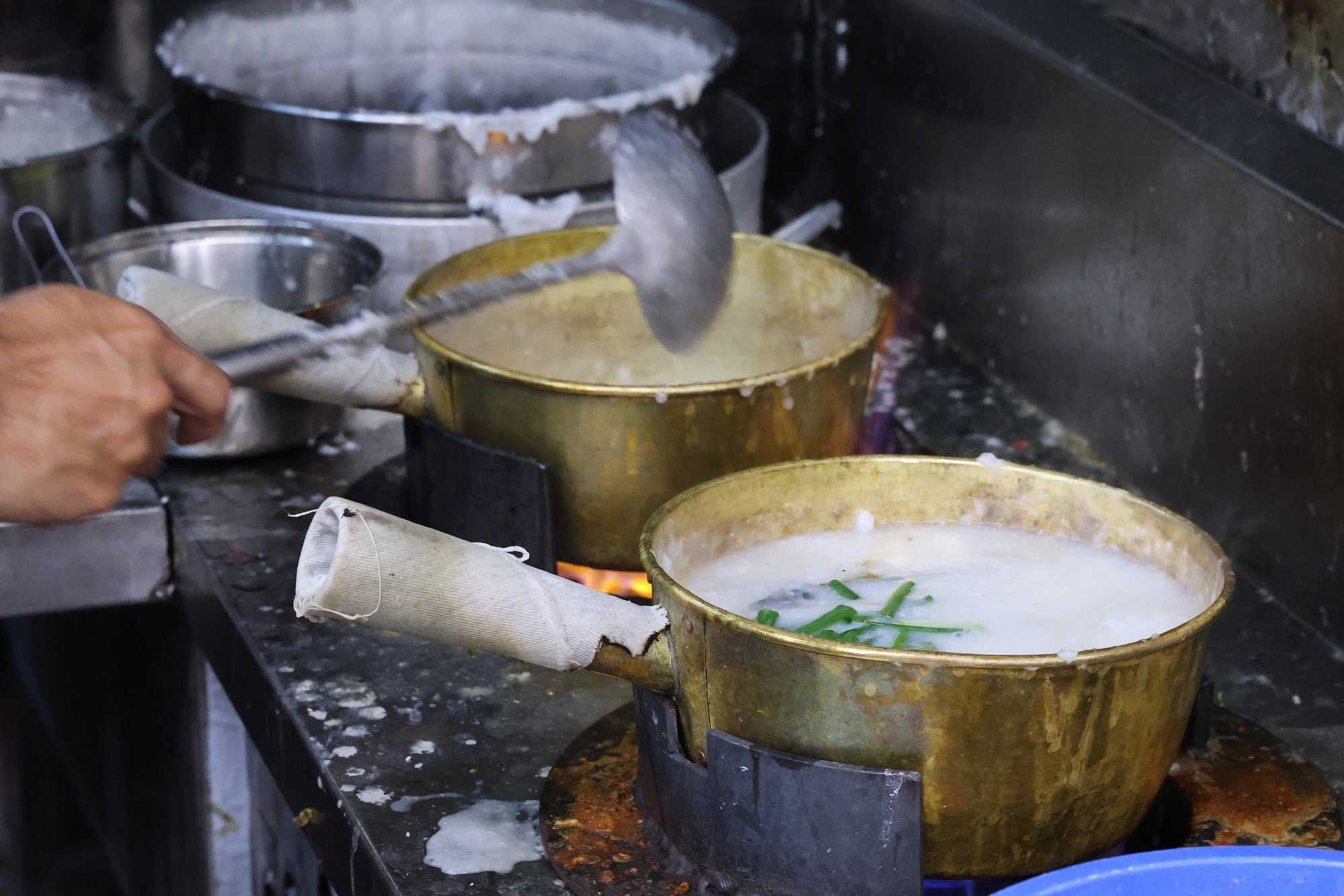 Chef Pierre Tsui at Mui Kee Congee, in the Cooked Food Centre in Mong Kok, uses traditional copper pots. Photo: Edmond So
