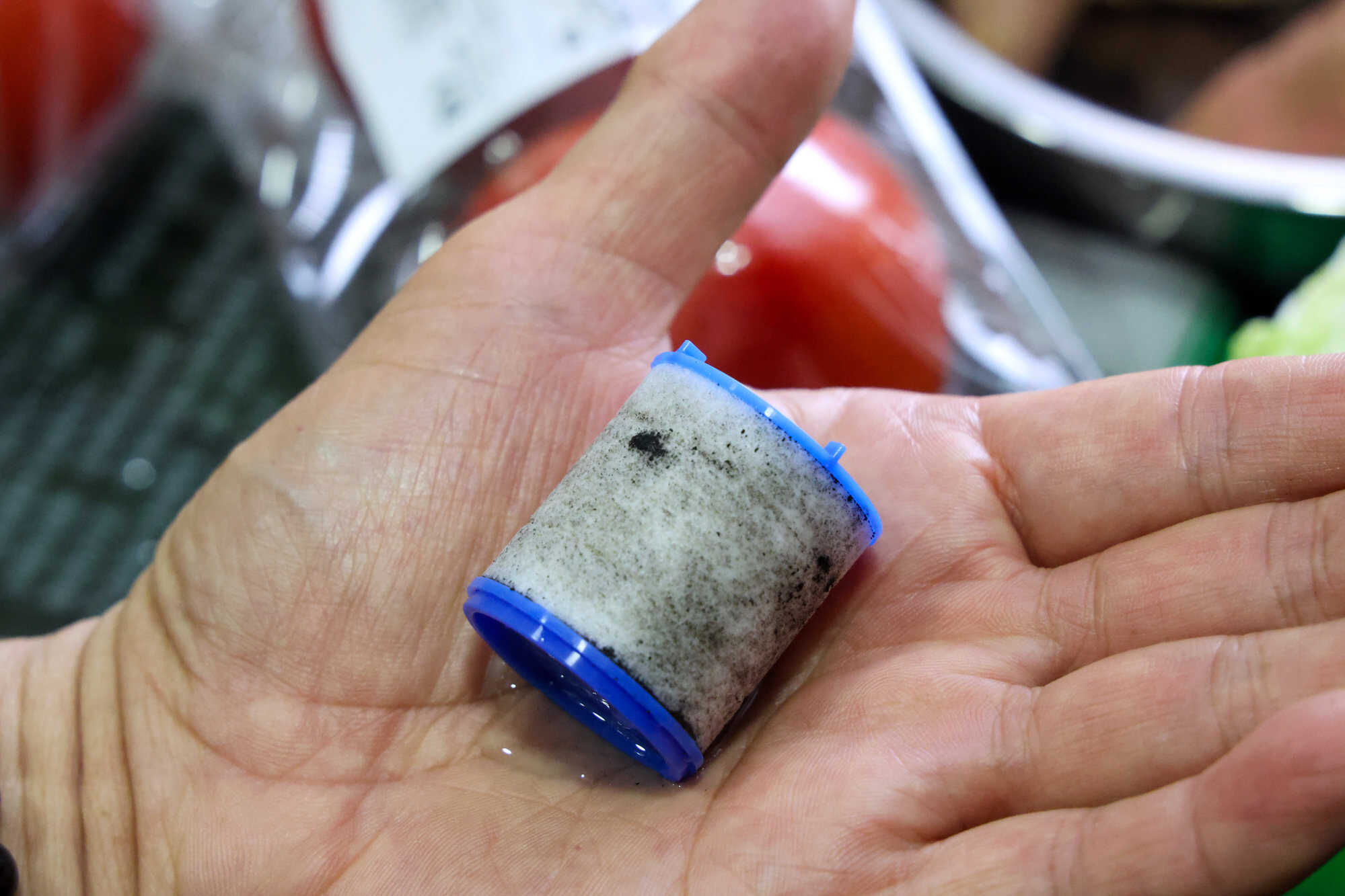 Residents of two Hong Kong public estates have started buying bottled water after finding black particles in their freshwater supply. Photo: Dickson Lee