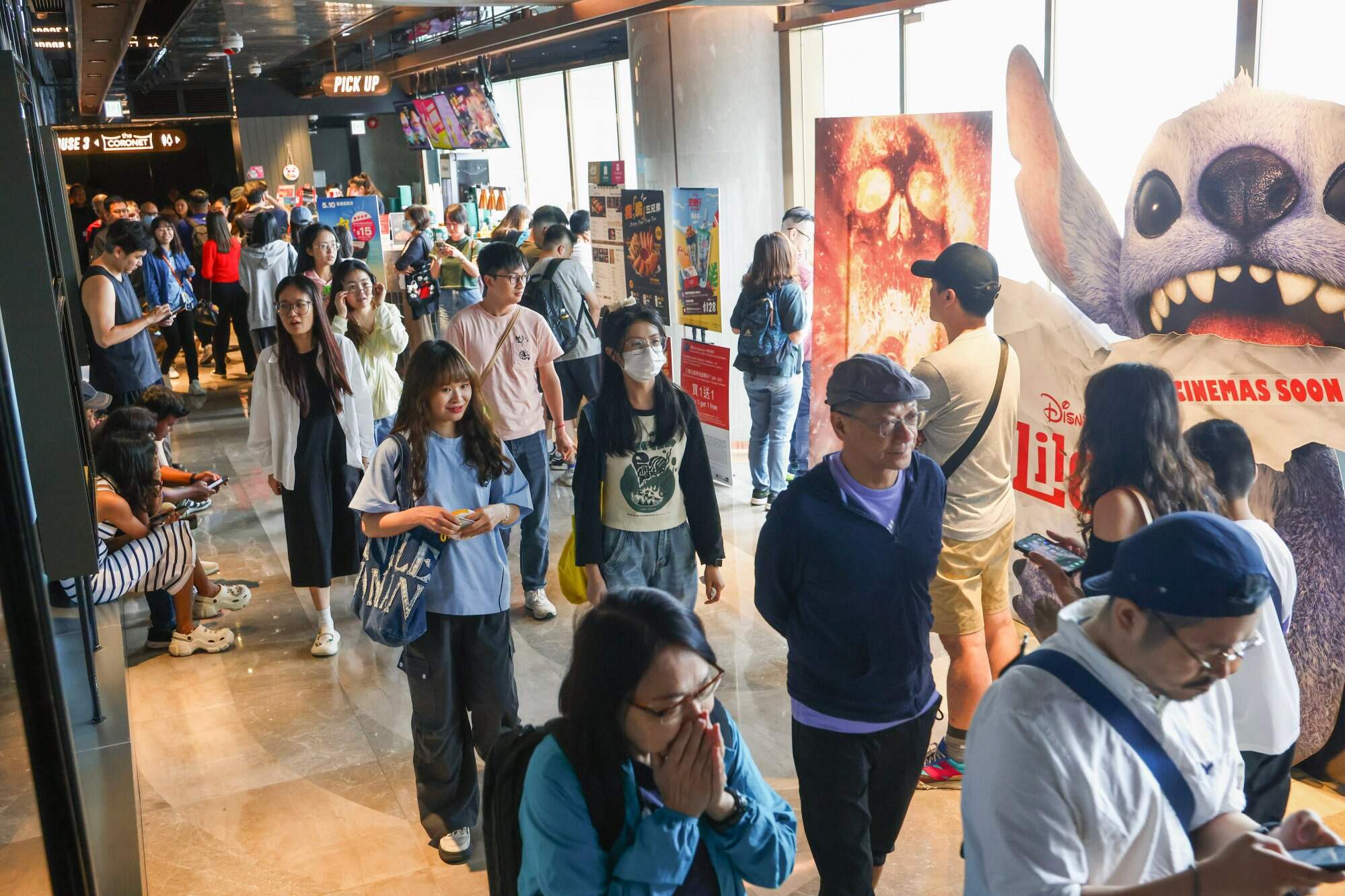 People head to Emperor Cinema at iSquare in Tsim Sha Tsui to watch a film on Hong Kong Cinema Day 2025. Photo: Dickson Lee