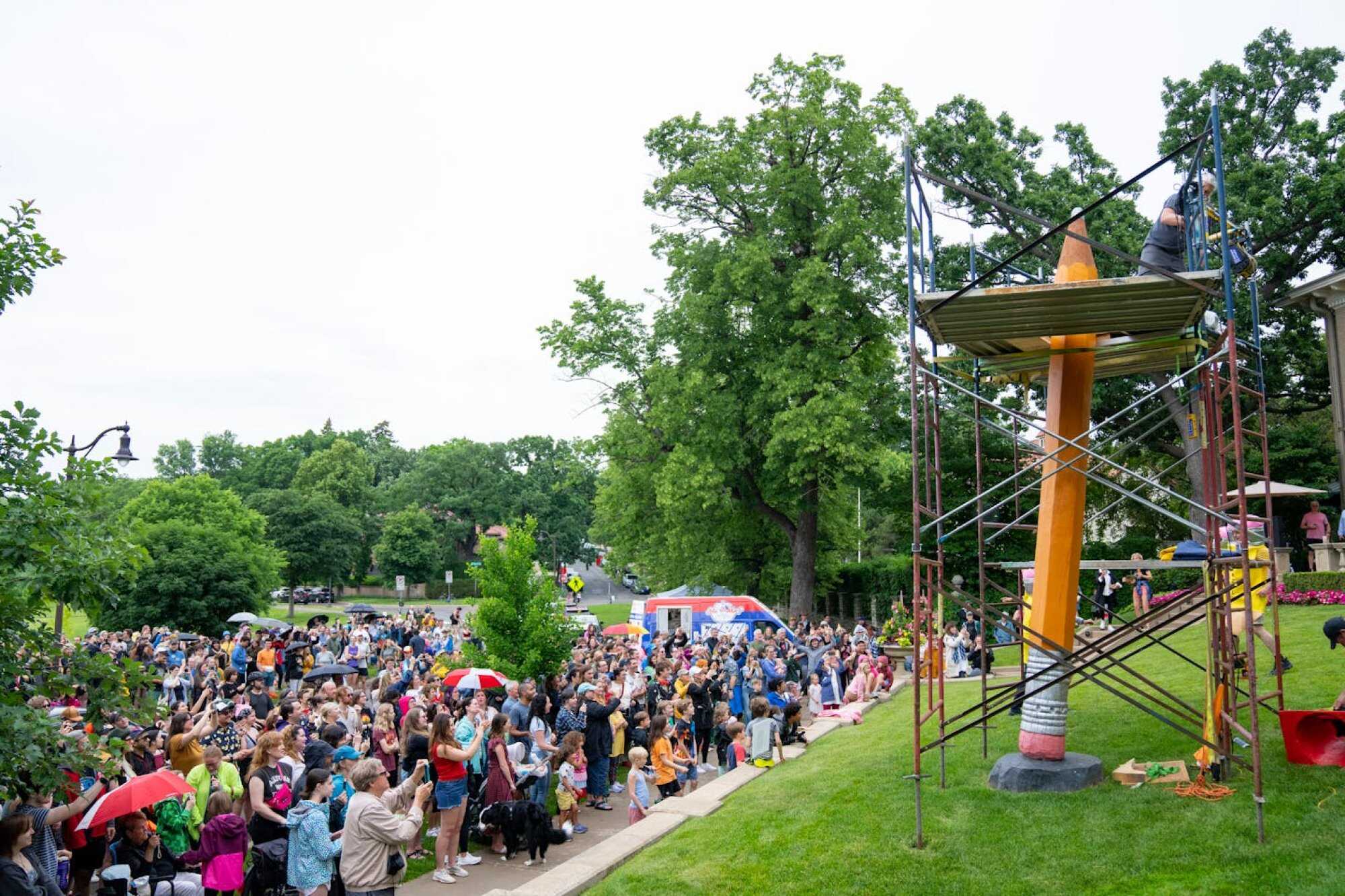 Hundreds of people gather every year to watch the annual sharpening of LOTI Pencil near Lake of the Isles in Minneapolis. Photo: TNS