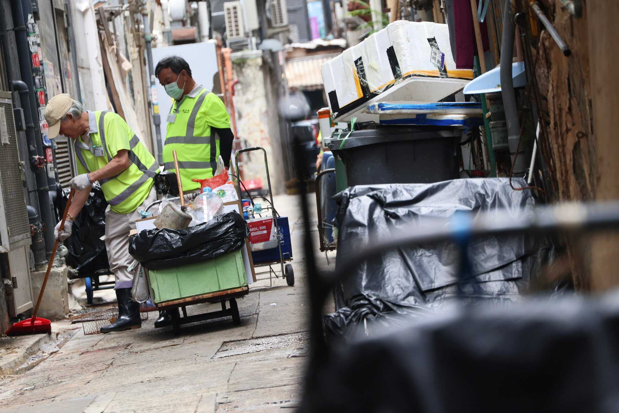 Cleaners on duty in Mong Kok. Hong Kong has raised its minimum wage to HK$42.10 per hour. Photo: Jelly Tse